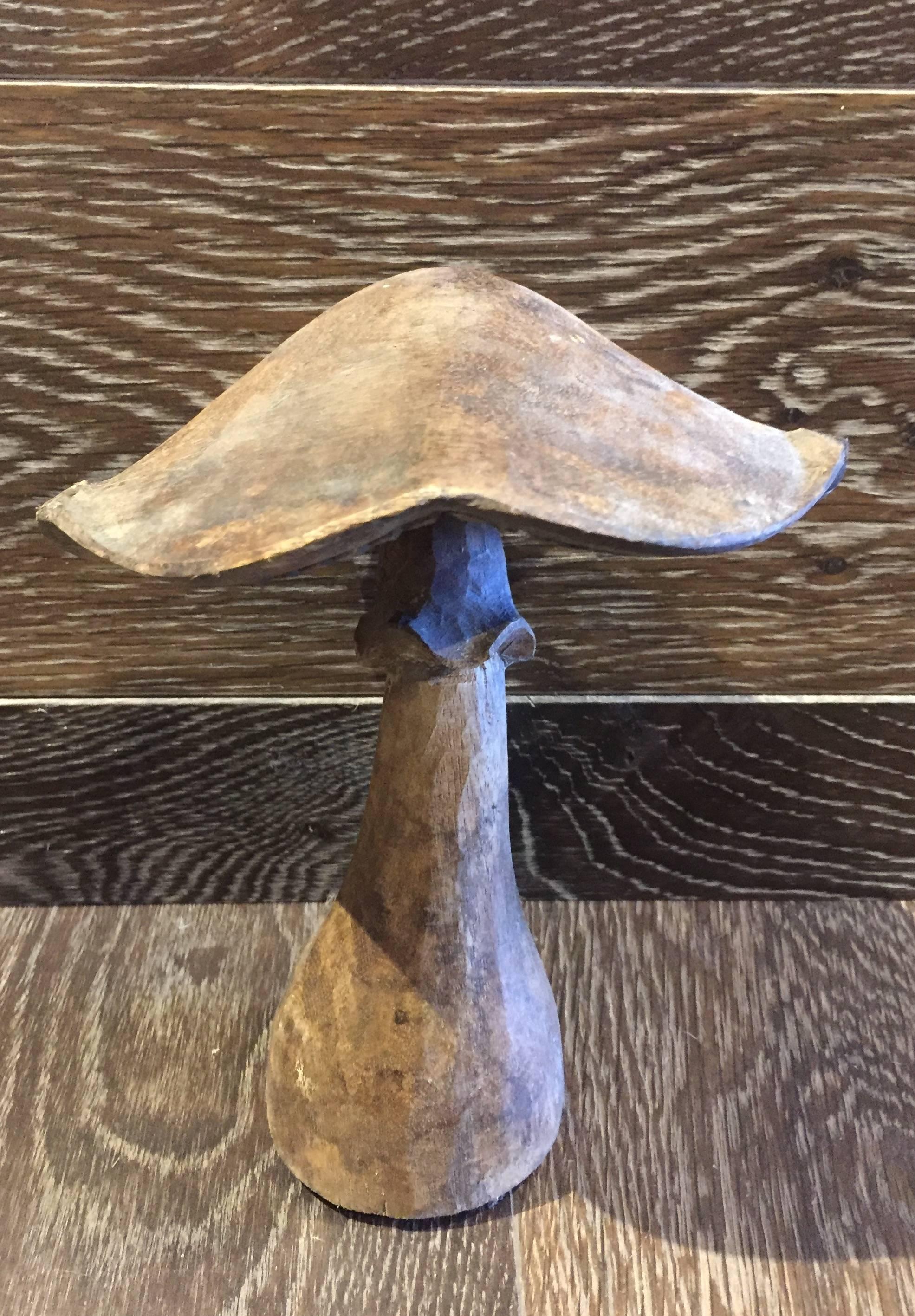 A set of seven hand-carved wooden mushrooms is varying sizes. Unusual and interesting. A unique decor set for any room or covered outdoor space. 

XXL - 50