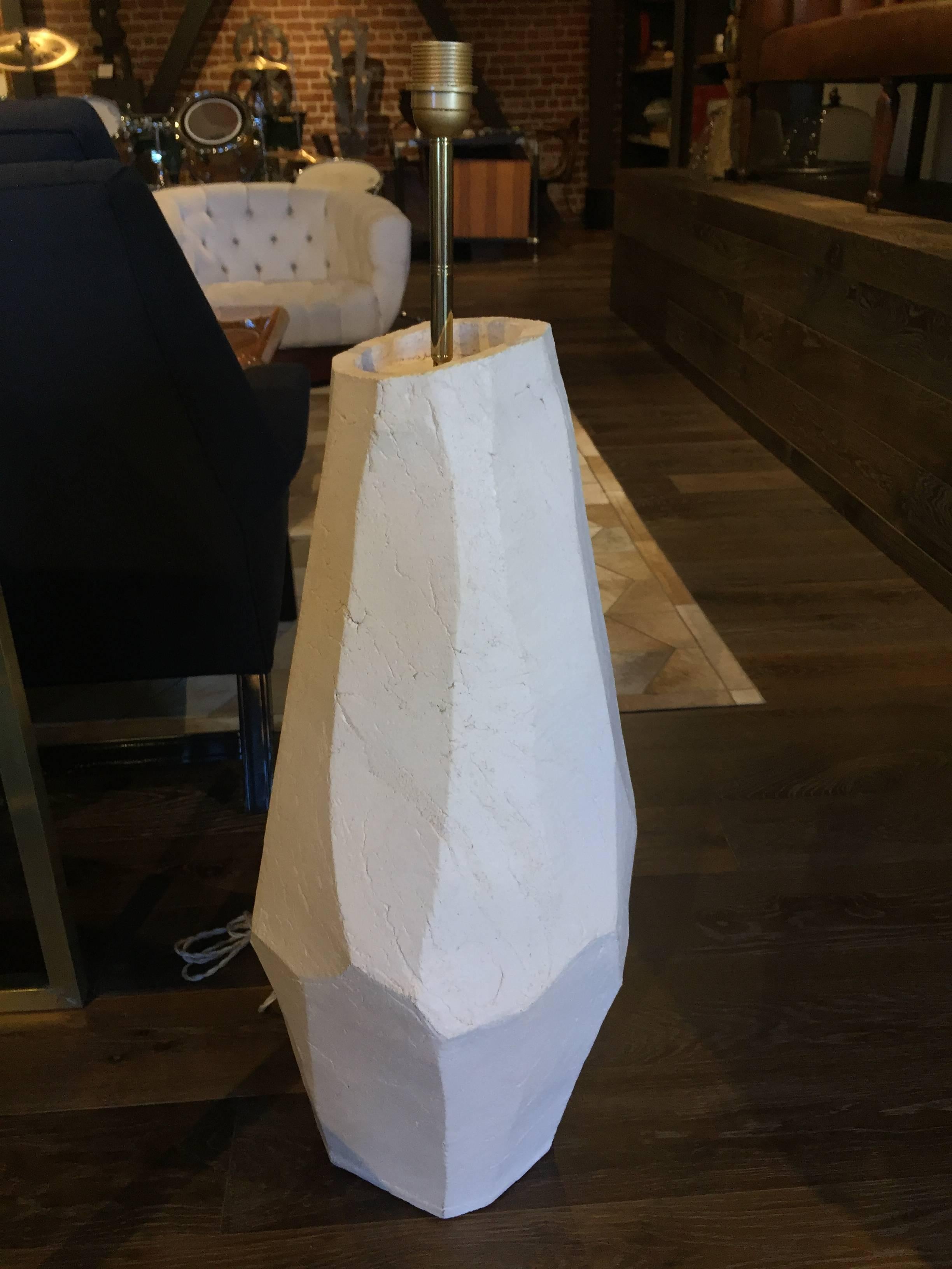 Faceted ceramic lamps are narrow and bold sculptural pieces that are both functional and artistic. Ceramic has organic character.

Shade is fabric lined in a beige color fabric.

Set of two.

Dimensions: 

Base dimensions: 14