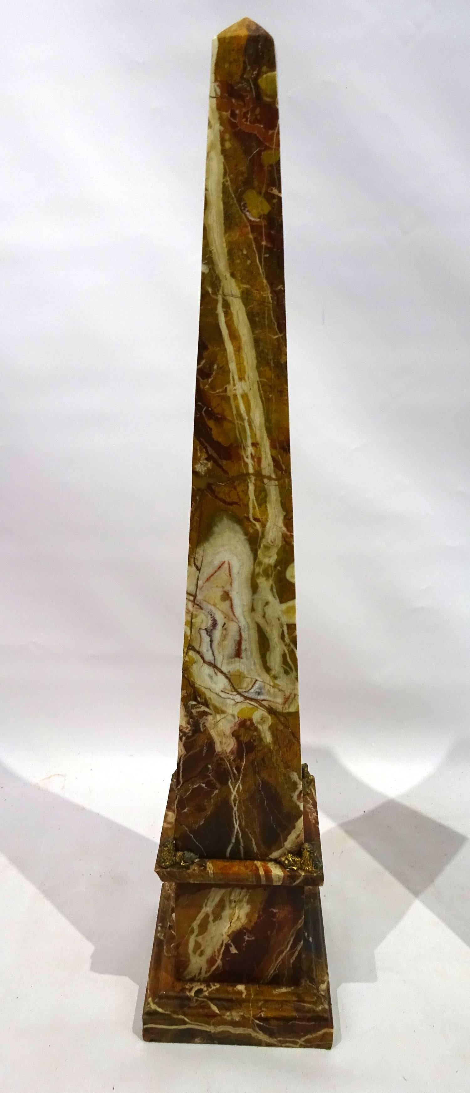 Pair of late 19th century jasper stone obelisks with ormolu lion detail on the corners of the base.