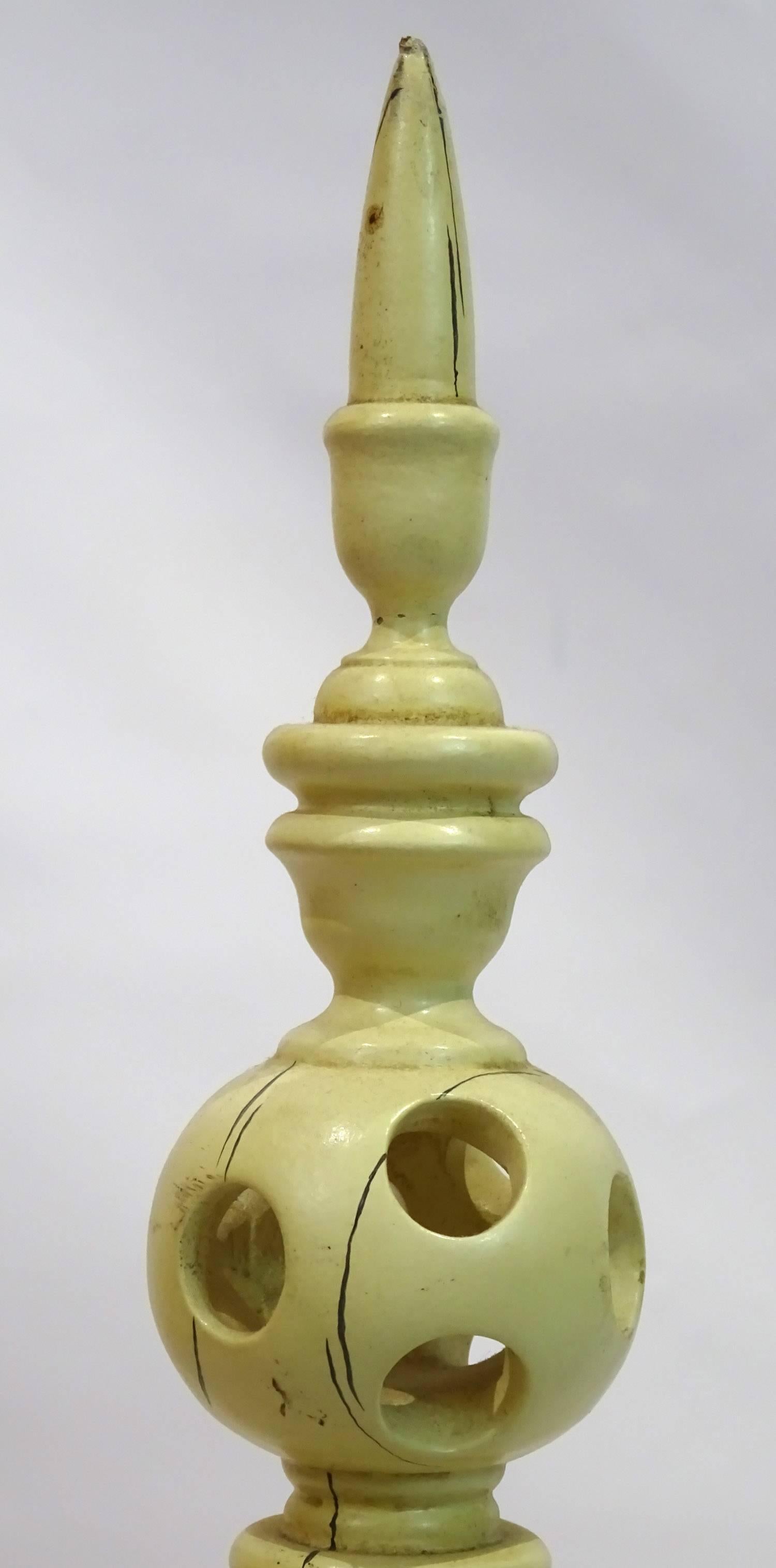20th century continental faux ivory carved wooden finial with painted stress cracks on the surface.

