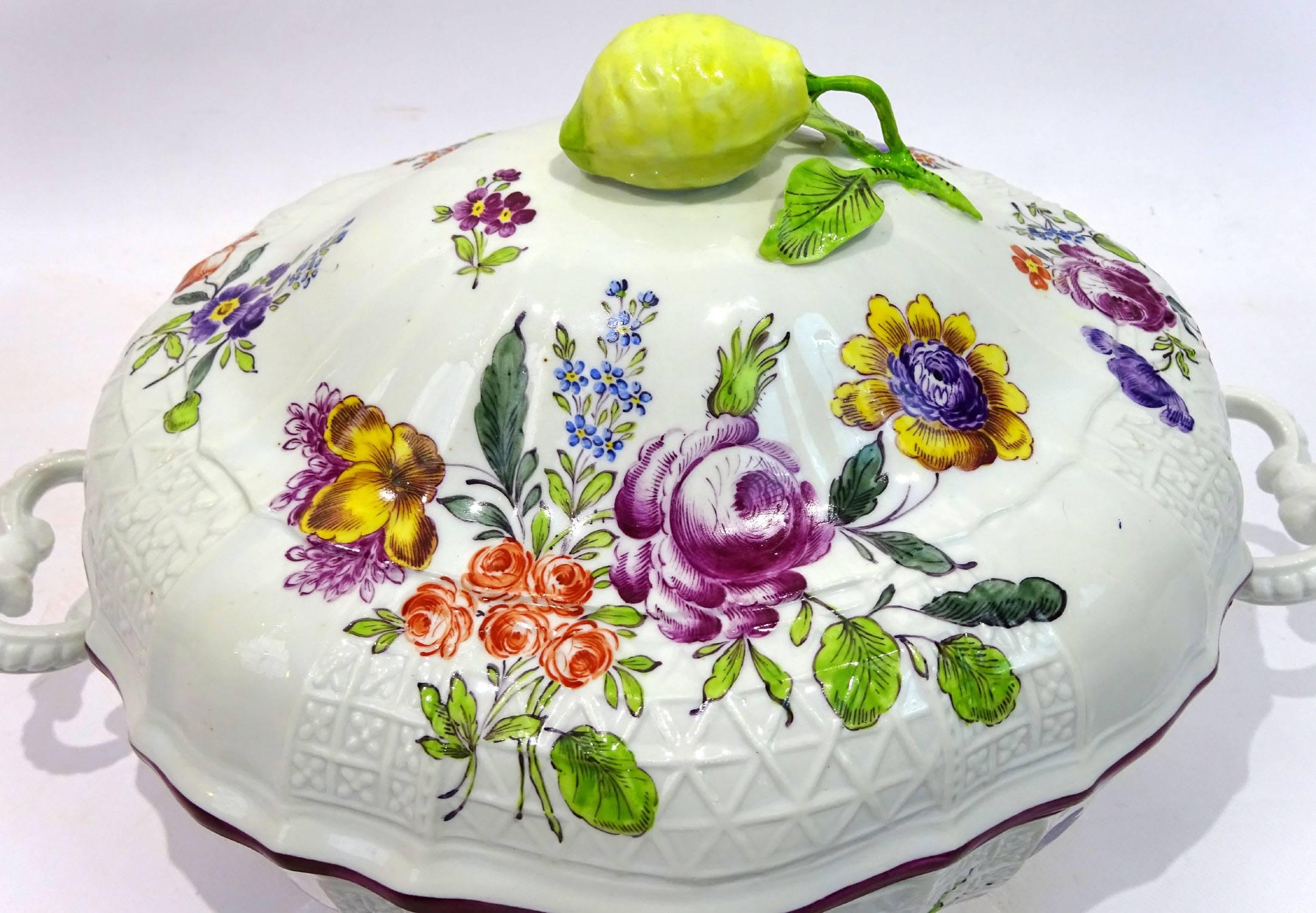 Early 20th century beautifully handcrafted Meissen style shaped porcelain tureen with floral design and lemon-shaped top handle, and stamped 