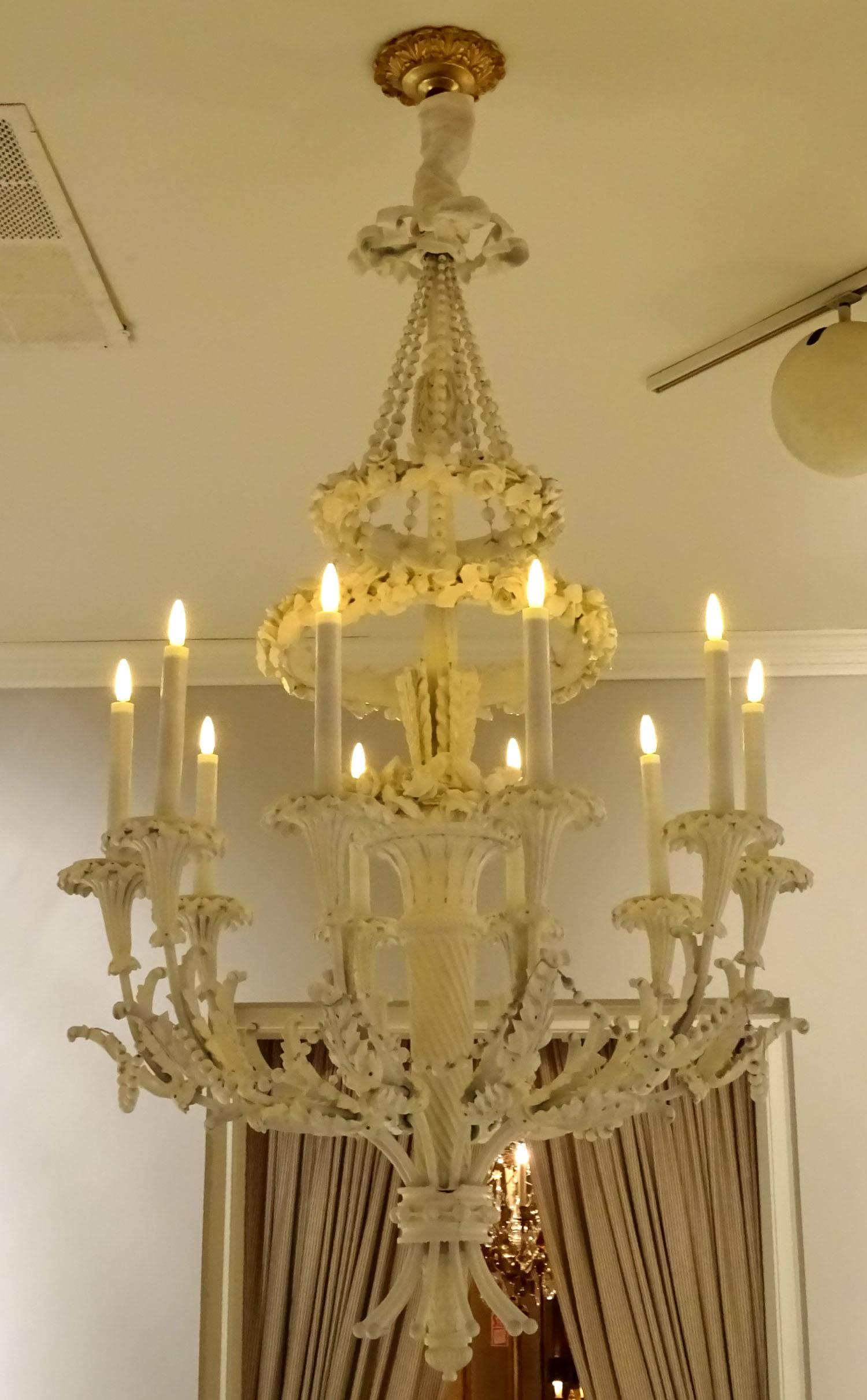 European Ornately Carved Wooden Ten-Light Chandelier For Sale