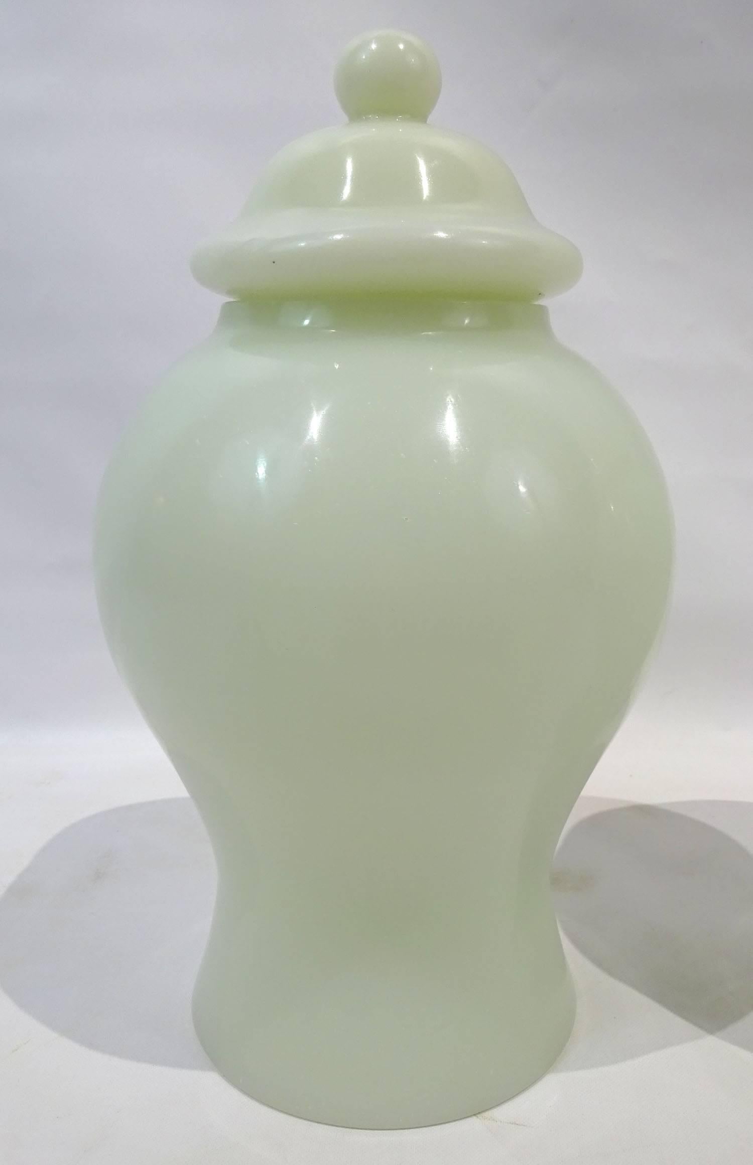 Pair of 20th Century Chinese Peking glass white jars with lids.