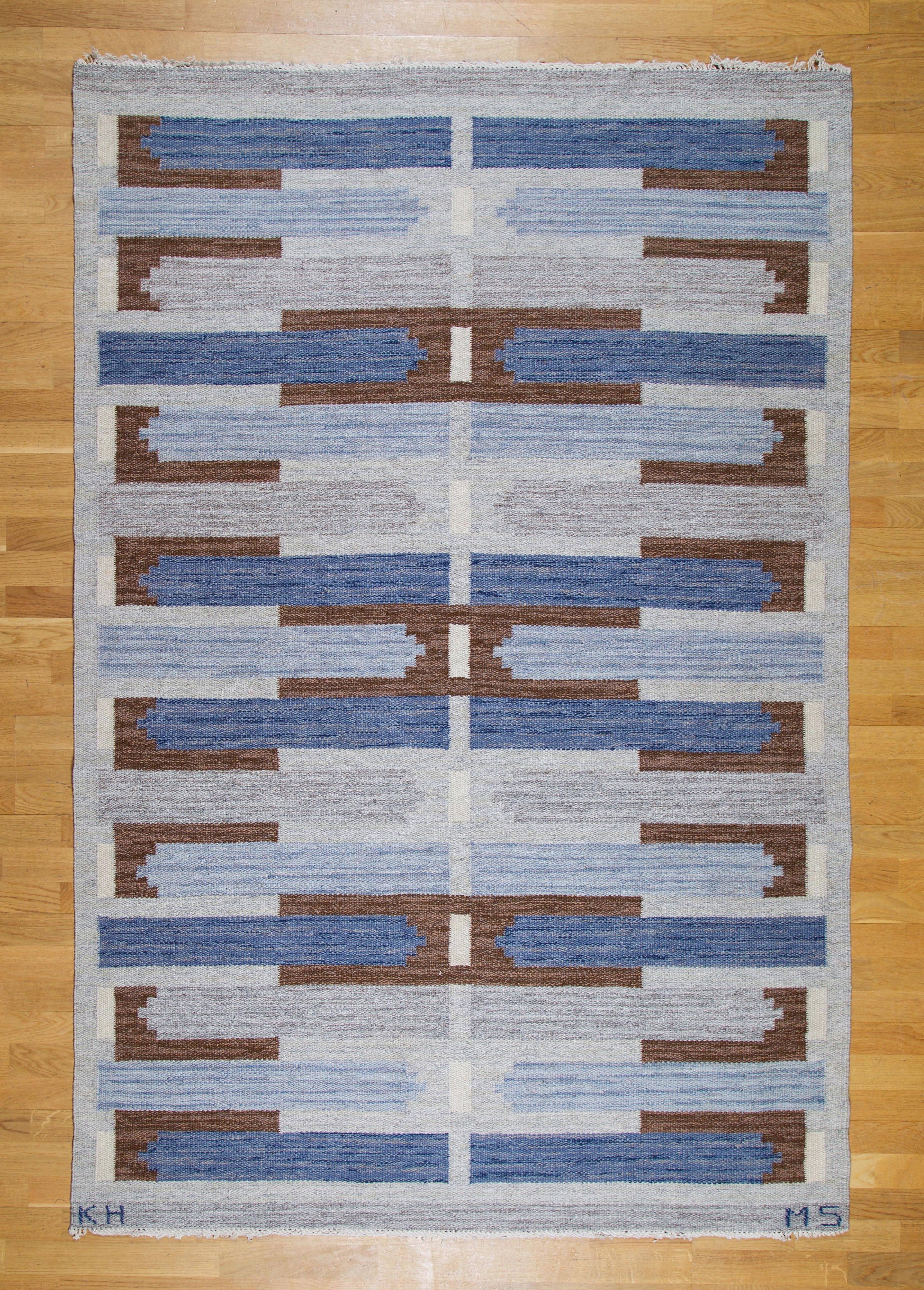 Mary Sandberg.

Flat-weave rug.

Klockargårdens Hemslöjd, Sweden, circa 1960s.
Wool, linen warp. Blue, grey, brown, natural hues.
Length 223 x width 150 cm.
87.79 L x 59 W inches

Swedish flat-woven rug by Mary Sandberg, circa1960s.