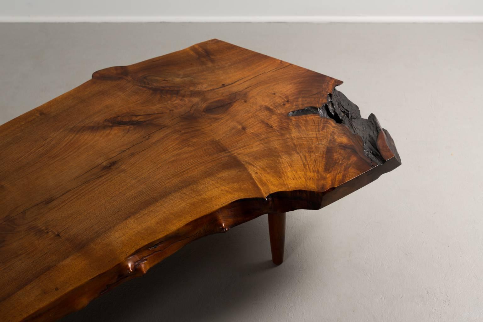 Large George Nakashima English walnut coffee table,

USA, circa 1961.

Measures: 85 x 37 x 13.5 in.
215 x 94 x 34.2 cm.

Signed to underneath with client's name.
Copy of original order card.