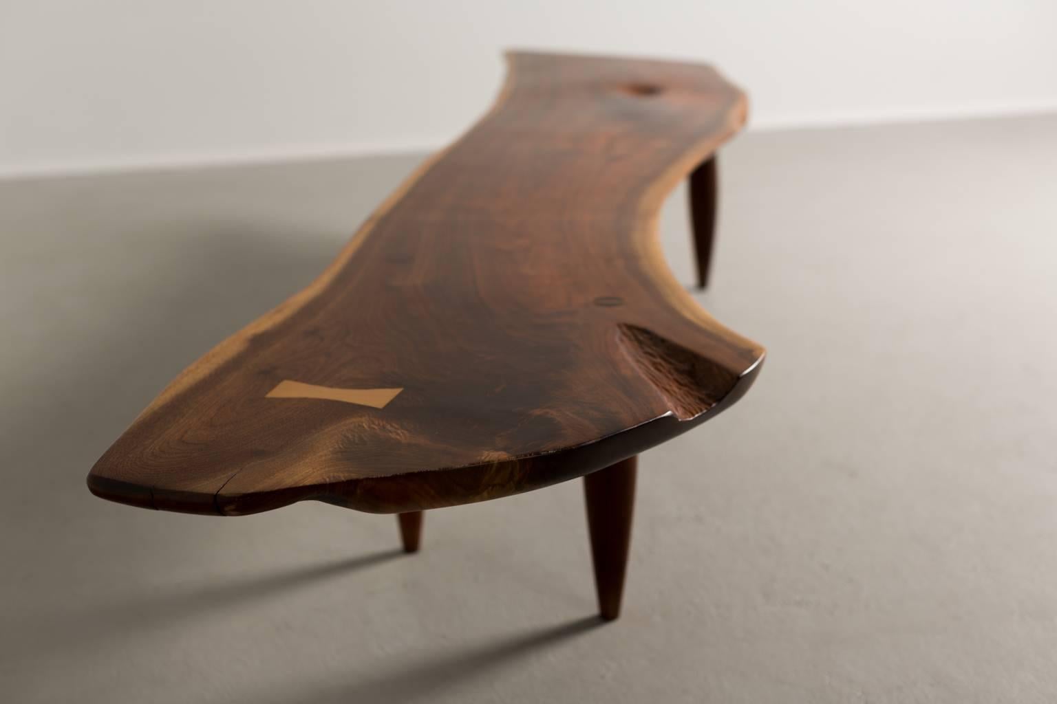Phillip Lloyd Powell bench or table.

Single slab with free edges, sap-grain detail and birch butterfly.

USA, circa 1958.

Black walnut, maple, birch.


