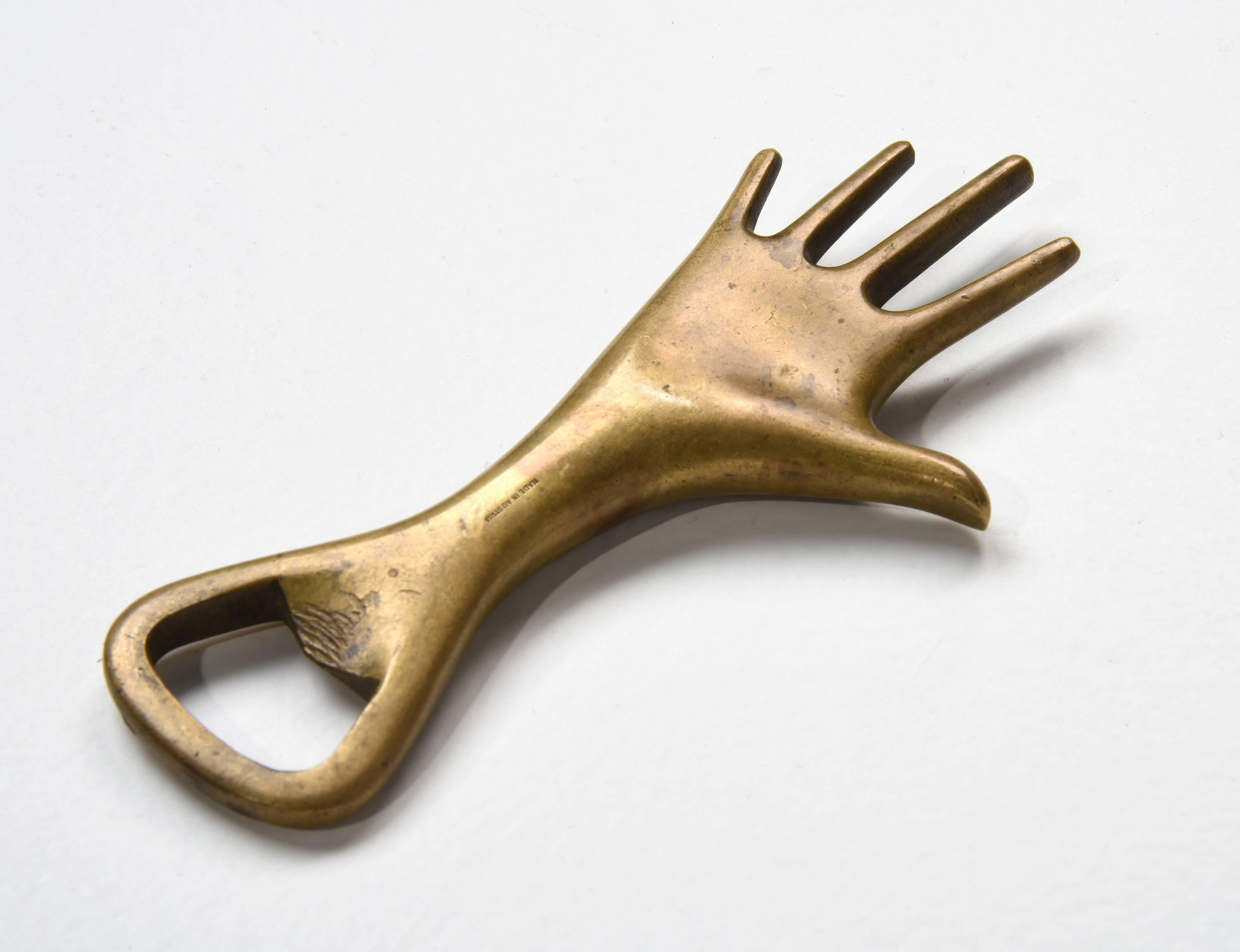 Signed Carl Aubock hand bottle opener, Model 4224.

Austria, circa 1950s.

Brass.

Measures: 5 x 2.25 in.

Literature: Carl Aubock The Workshop pg 215.
  