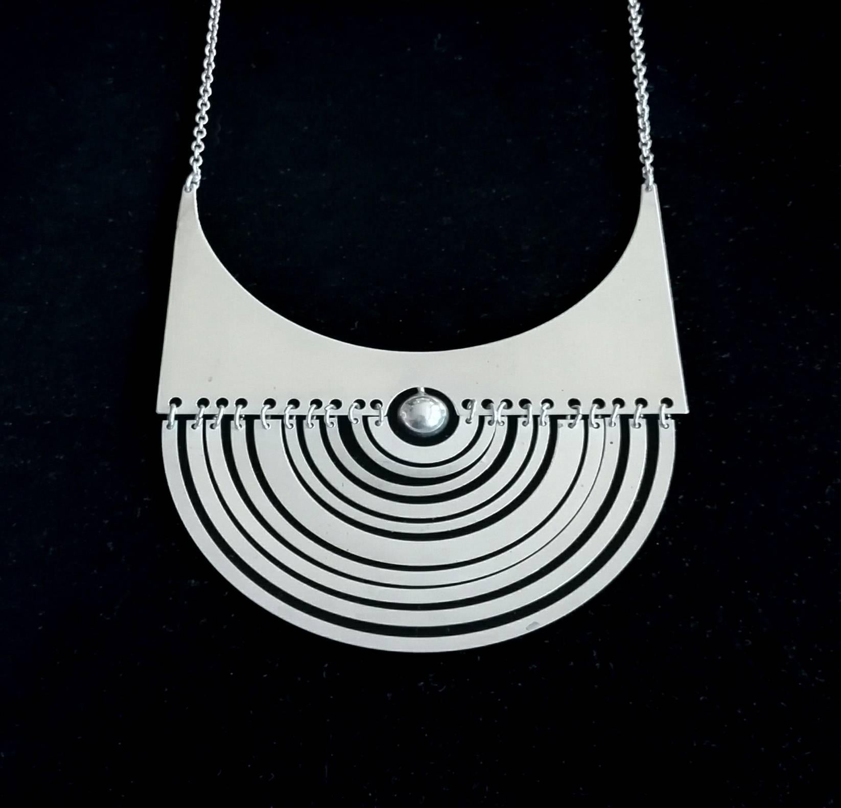 Tapio Wirkkala Half Moon "Puolikuu" necklace

Finland, circa 1972 (early example and not a reproduction)

Sterling silver

Produced by N Westerback, Finland
Impressed with N7, silver mark, Finnish assay and date marks.

Chain 18 in
Pendant