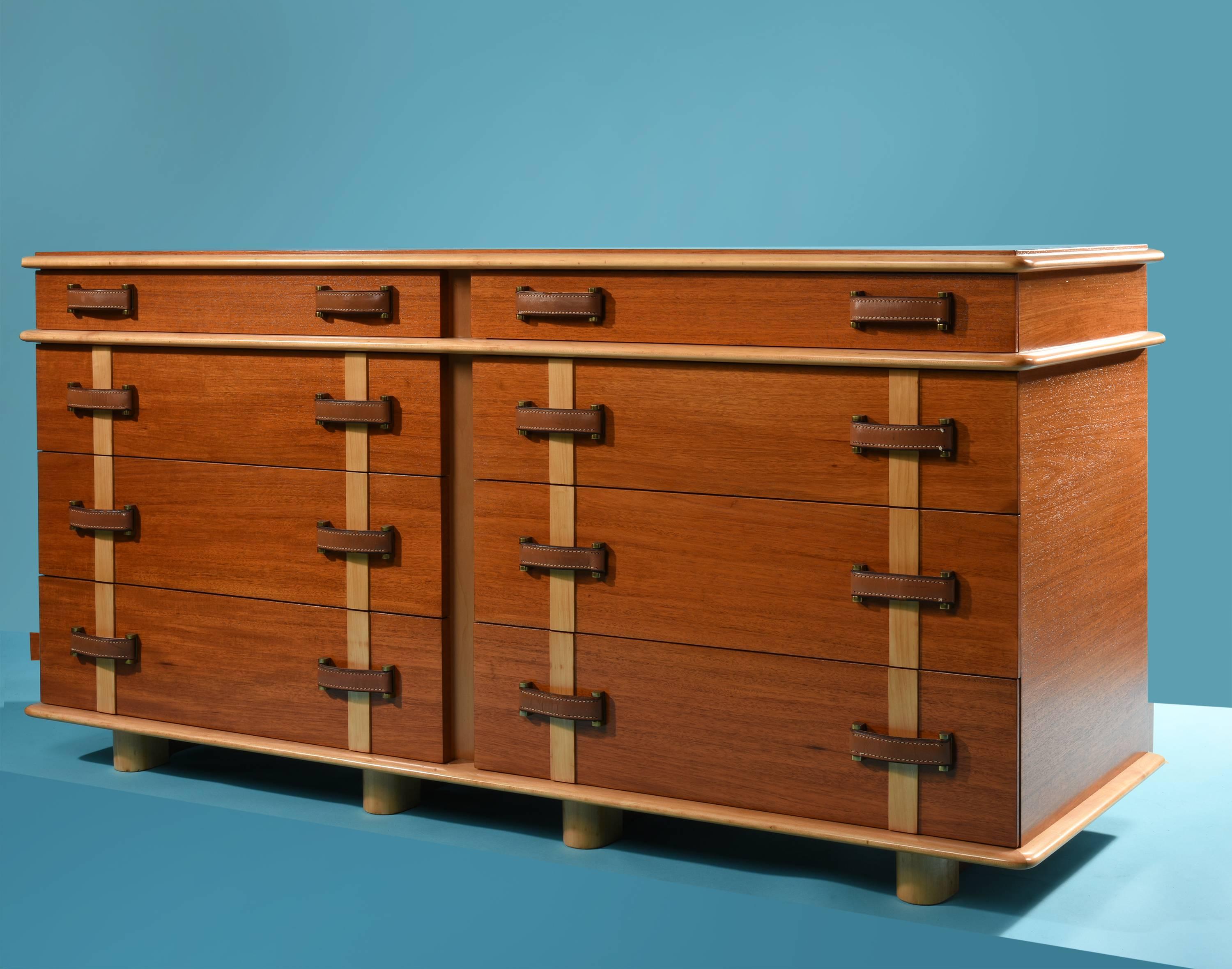 Paul Frankl for Johnson Furniture Company cabinet, from the Station Wagon series

USA, 1945

Mahogany, birch, leather, maple, brass 
Eight drawers with stitched leather pulls

Measures: 66 W x 22 D x 32 H in 
168 x 56 x 81 cm 

Signed: