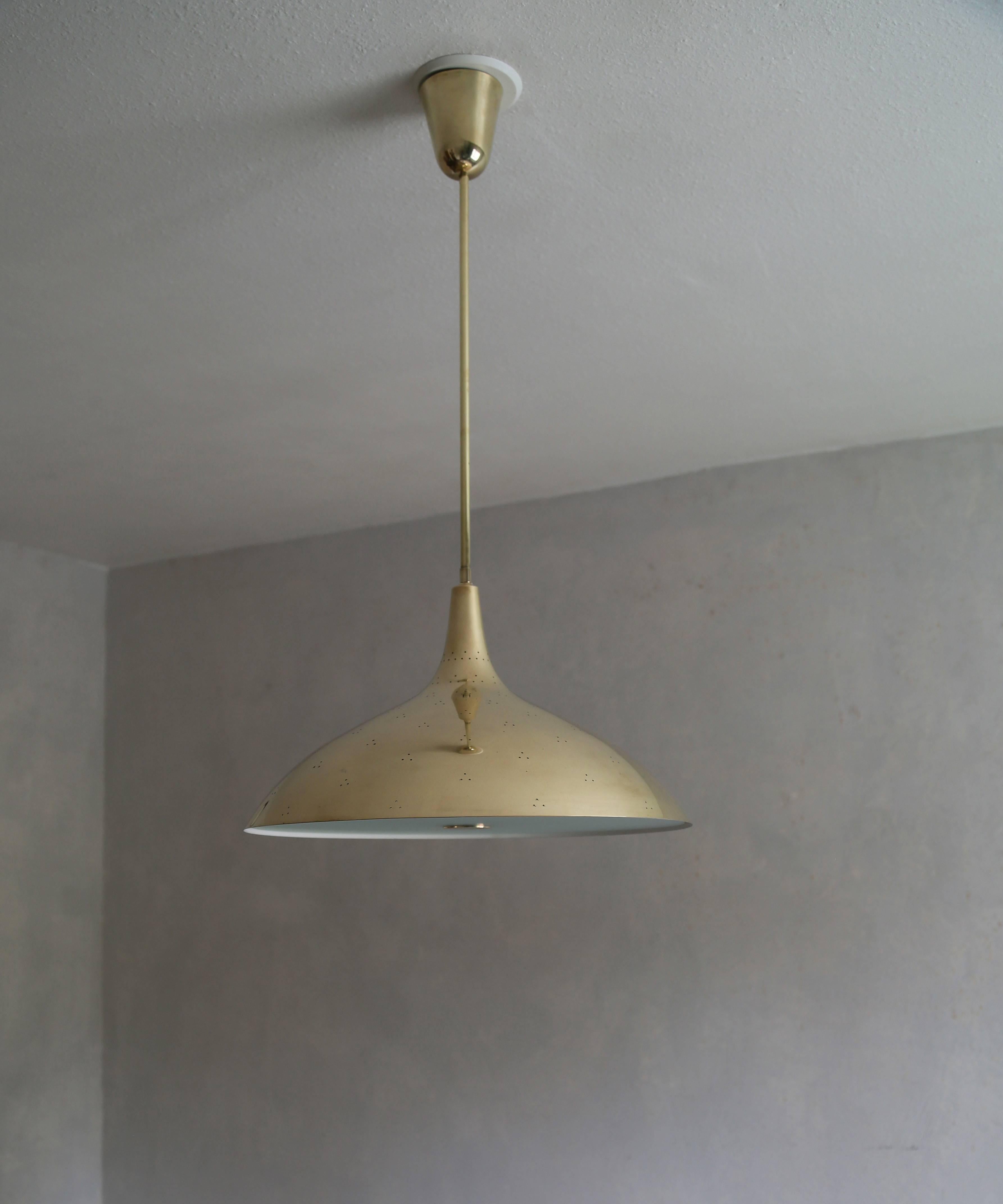 Ceiling lamp model No. J1965 by Paavo Tynell.

Early edition by the original manufacturer Taito Oy

Finland, late 1940s.

Impressed with manufacturer's label TAITO.

Brass and white lacquered brass with a frost glass diffuser.

45 dia x 75 h