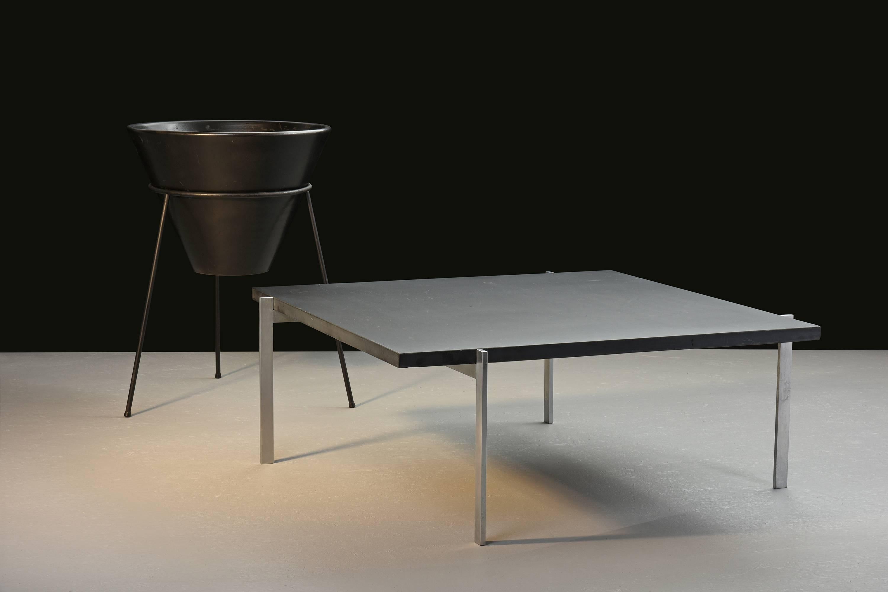 Poul Kjærholm, Model PK 61 table with black slate top

E. Kold Christensen.
Denmark, 1956.
Slate, chrome-plated steel.
Measures: 33.5 W x 33.5 D x 12.75 H inches.

Early example with manufacture's mark

Single estate ownership 