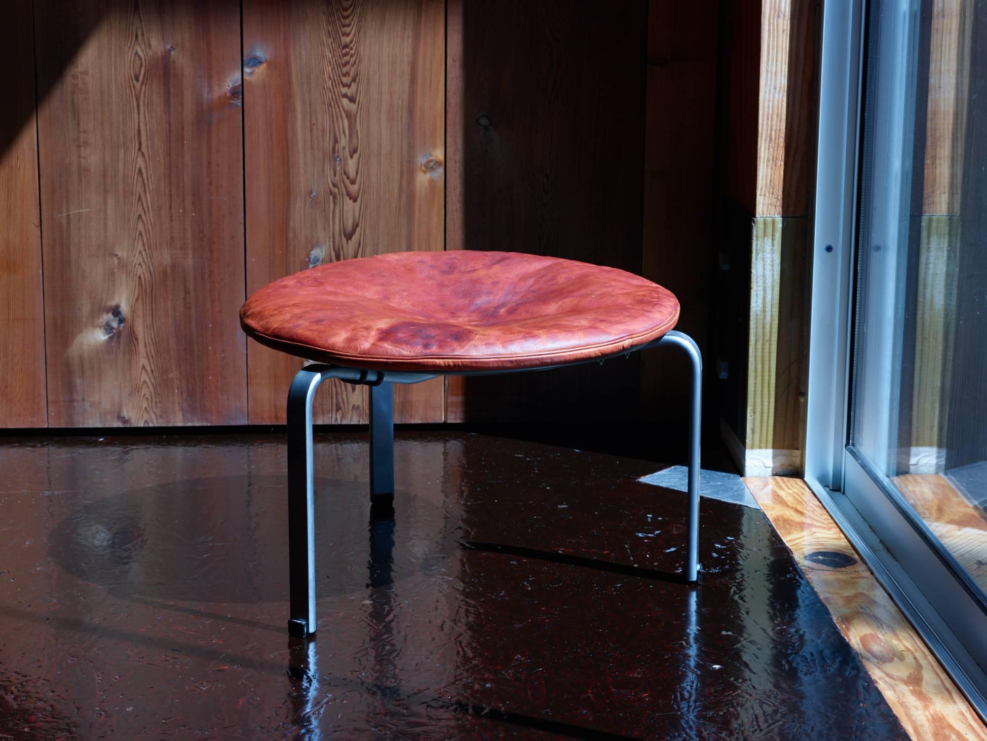 Poul Kjærholm, original condition.

PK 33 stool.

E. Kold Christensen,
Denmark, 1959.
Matte, chrome-plate spring steel with patinated, laminated wood.

Dimensions: 53.34 x 35.56 cm.
21 diameter x 14 H inches.
