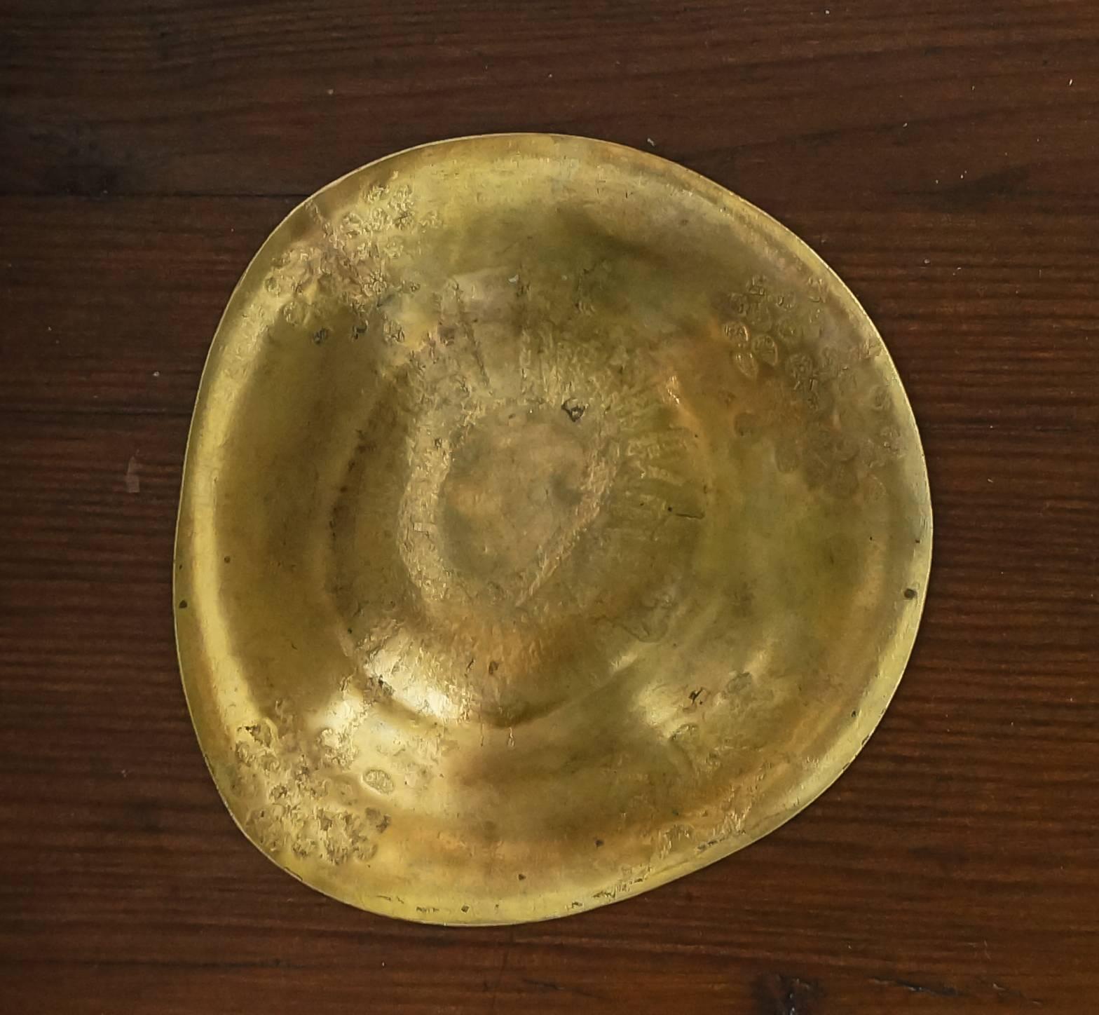 Tapio Wirkkala "Keskiyön Taikaa" (Midnight Magic)

Handmade brass bowl by jewelry maker, Oy Tillander Ab.

Helsinki, Finland, circa 1952.

Measures: 7/10 × 4 1/2 × 4 3/10 in.
1.9 × 11.5 × 11 cm.

Limited edition, designed for the Olympic