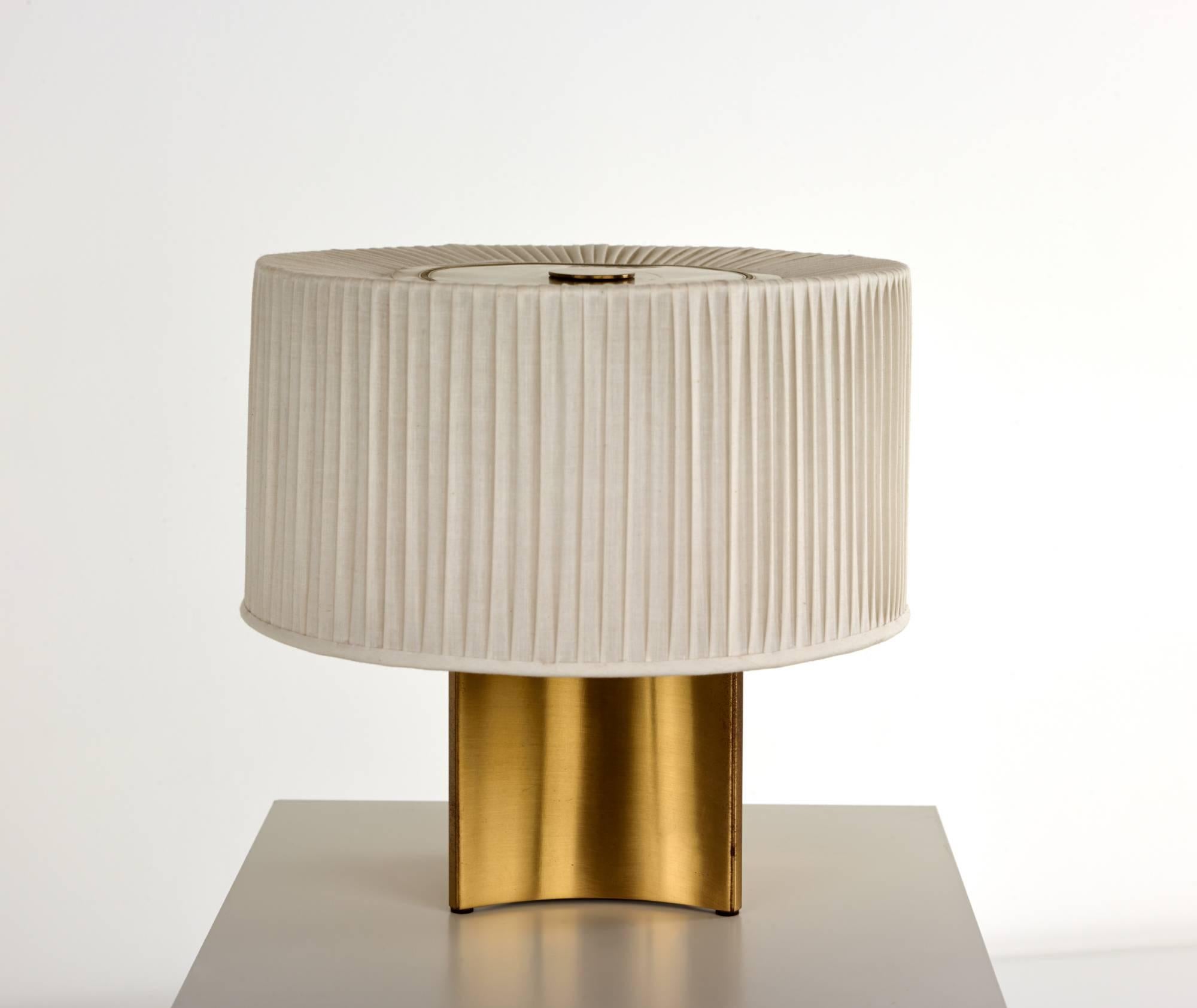 Paavo Tynell,

table lamp.

Taito Oy.
Finland, circa 1945.

Brass, linen.
Measures: 12 diameter x 11.5 H in (30 x 29 cm).