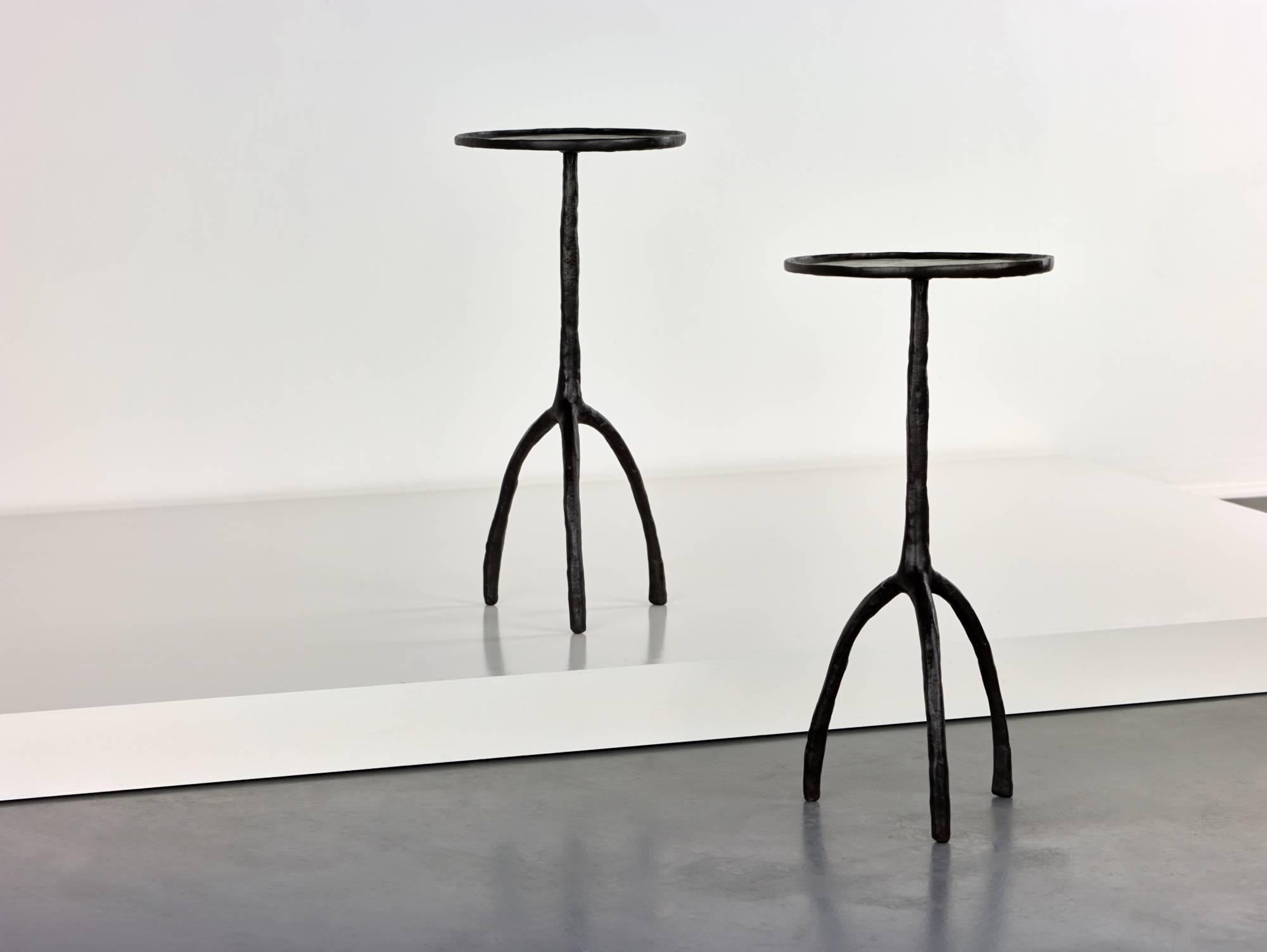 Cast bronze occasional tables by Christian Liaigre,

USA, circa 2000.
Cast bronze.

Signed with manufacture's mark to the base [CL].

Measure: 27 x 57 cm.