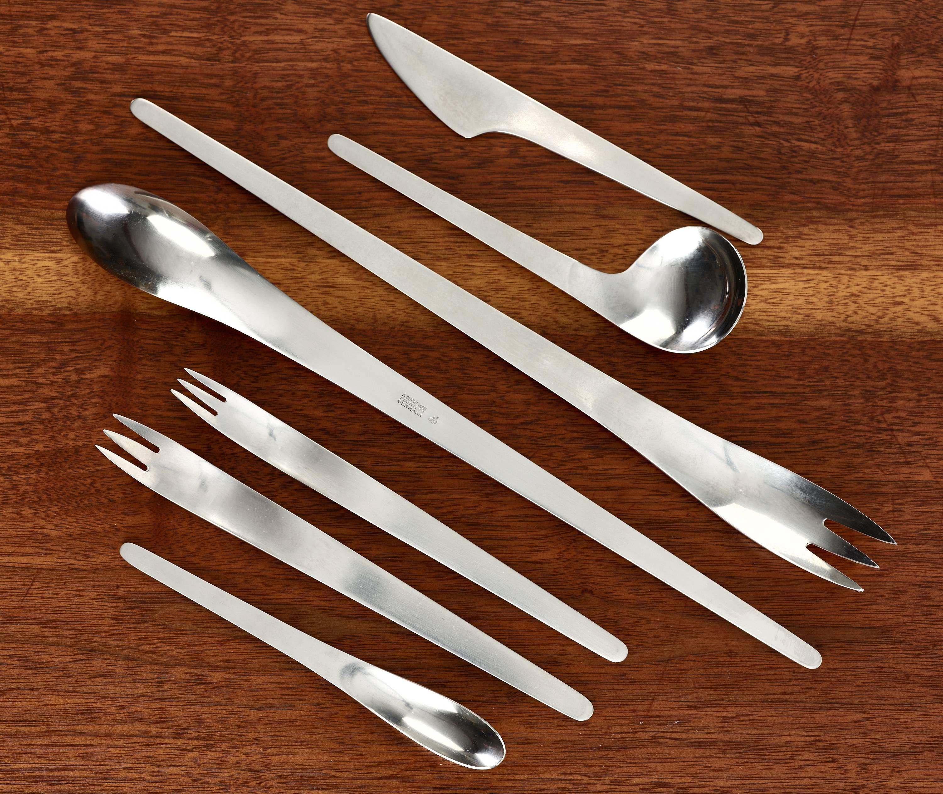 Arne Jacobsen AJ flatware.

A. Michelsen.
Denmark, 1957.
stainless steel.

Complete seven-piece service for 12 with two additional utensils; 86 pieces total. Signed with impressed manufacturer's mark to each piece:

12 - dinner knife.
12 -