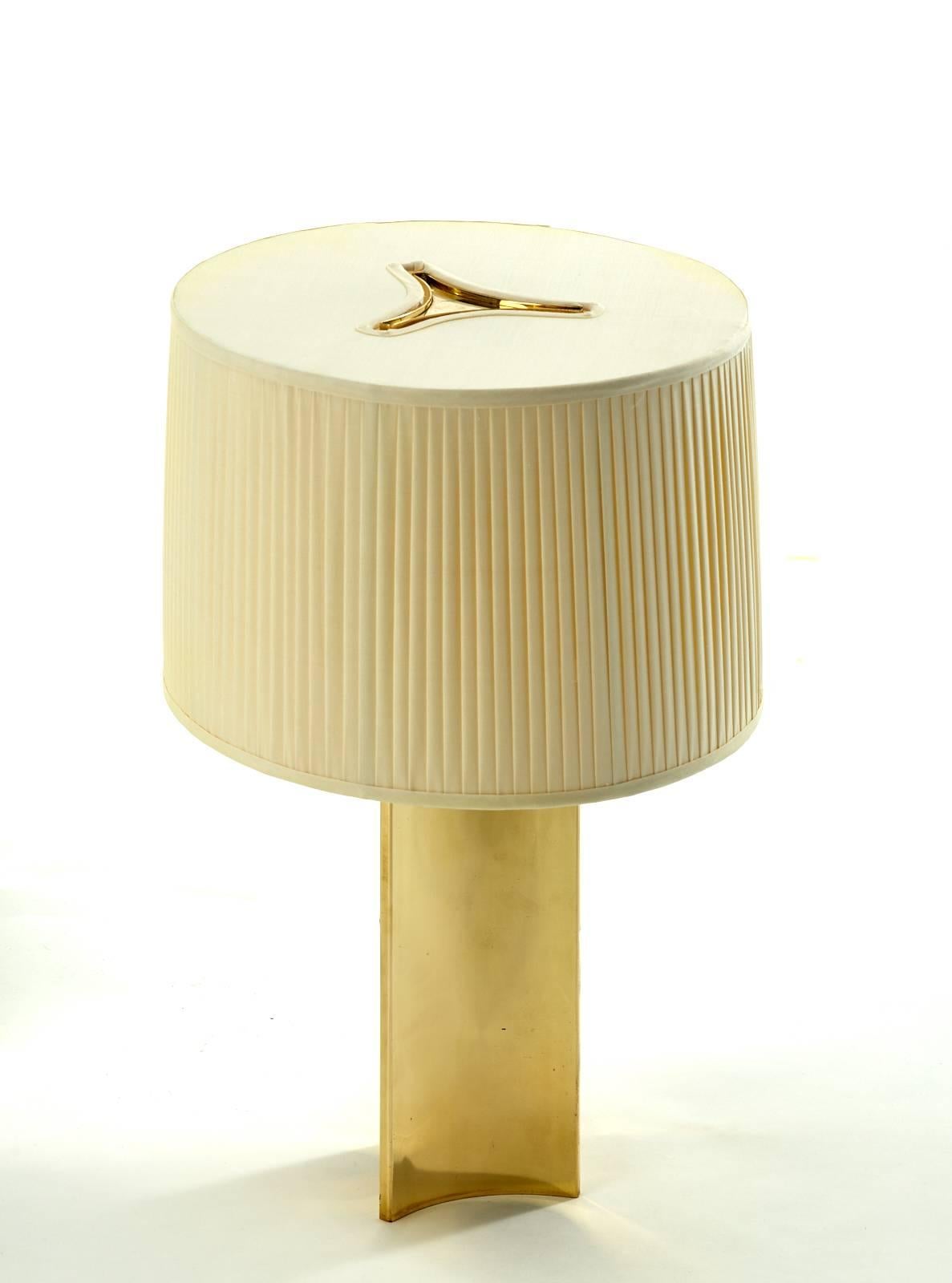 Rare pair of Paavo Tynell table lamps, Taito Oy

Finland, circa 1945

Measures: 14 D x 22 H in (36 x 56 cm) 
Pleated silk shade, contoured brass base.

Signed with impressed manufacturer's mark to underside of base: [Taito AB 546 D Made in