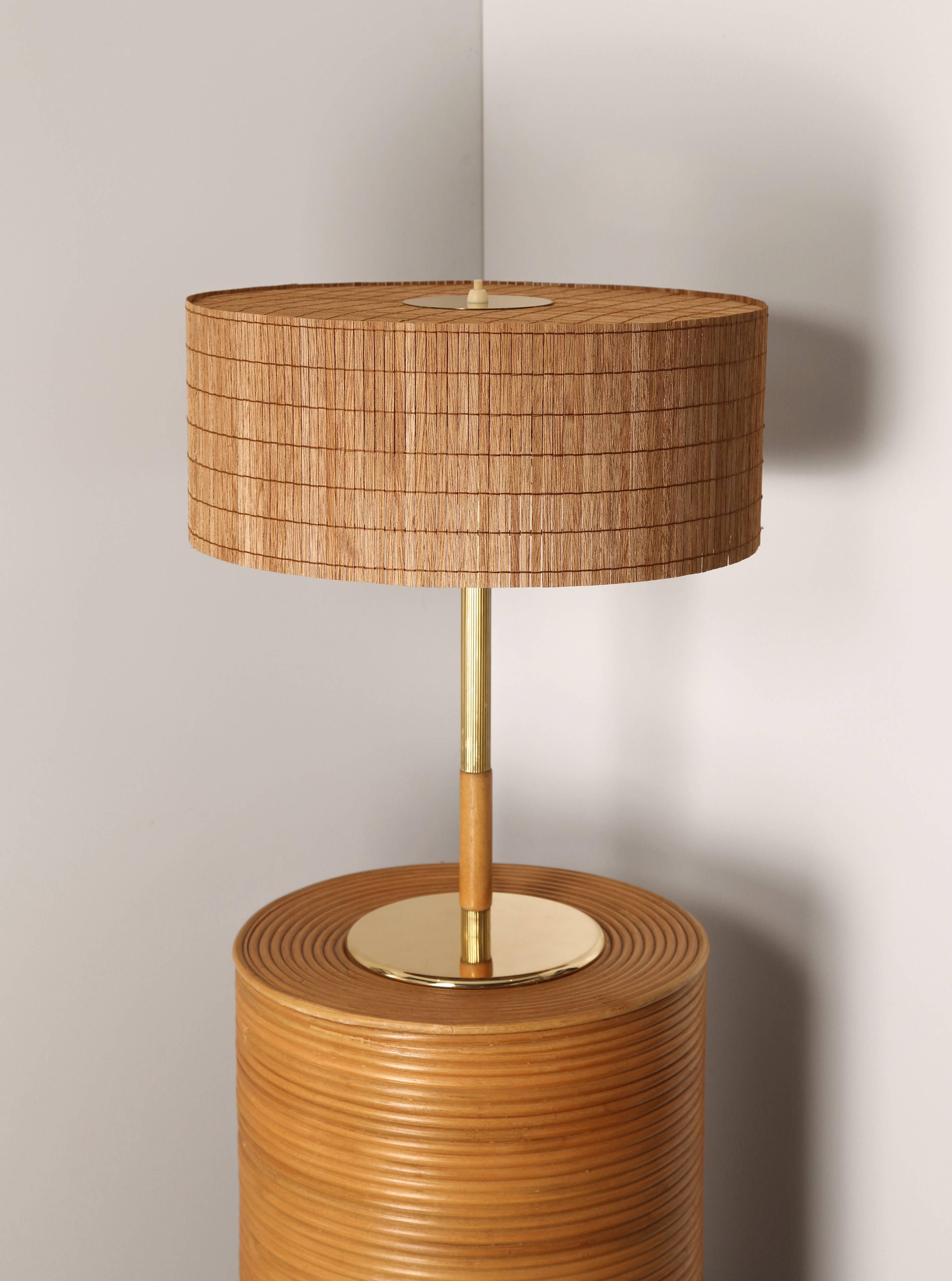 Early table lamp by Paavo Tynell, Model 9206. 

Manufactured by Taito Oy
Finland, mid-1940s. 

Impressed with: 
Manufacturer's mark underside O/Y TAITO A/B. 

Measures: 47 H x 17 D cm 
40 D cm diameter (shade only)
17 D cm (base)

Stem: