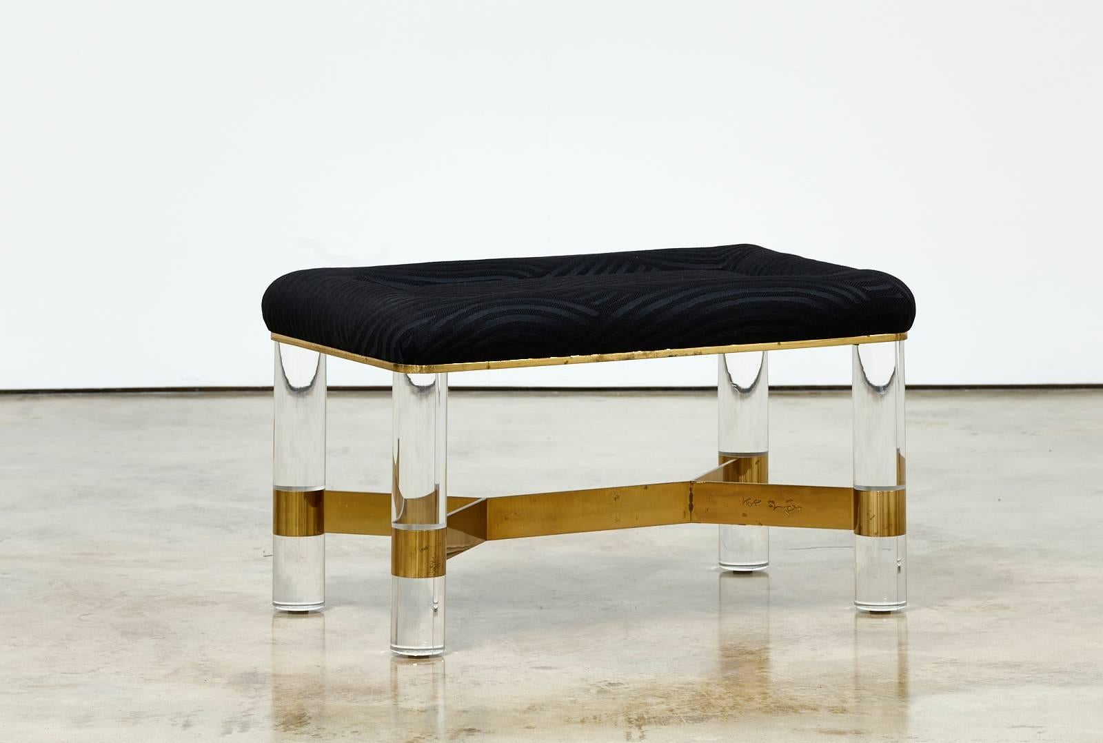 Signed Karl Springer Lucite bench with brass 

United States, 1980s
Signed Karl Springer

Measures: 18 H x 27 W x 20 D in

Lucite, brass, fabric.

 