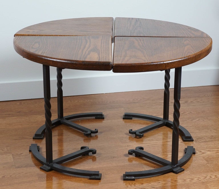 Four section, oak circular table, with interesting iron base.
Comprised, of four separate side tables, that group together, forming a 30