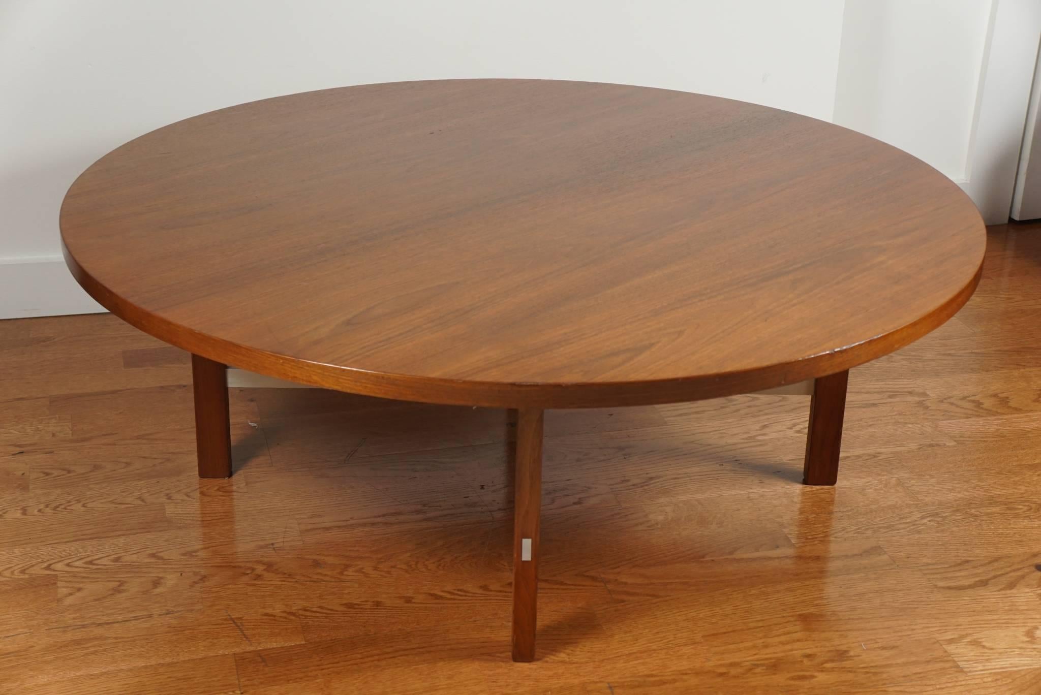 Handsome, round cocktail table, with brushed chrome accents. Newly refurbished.