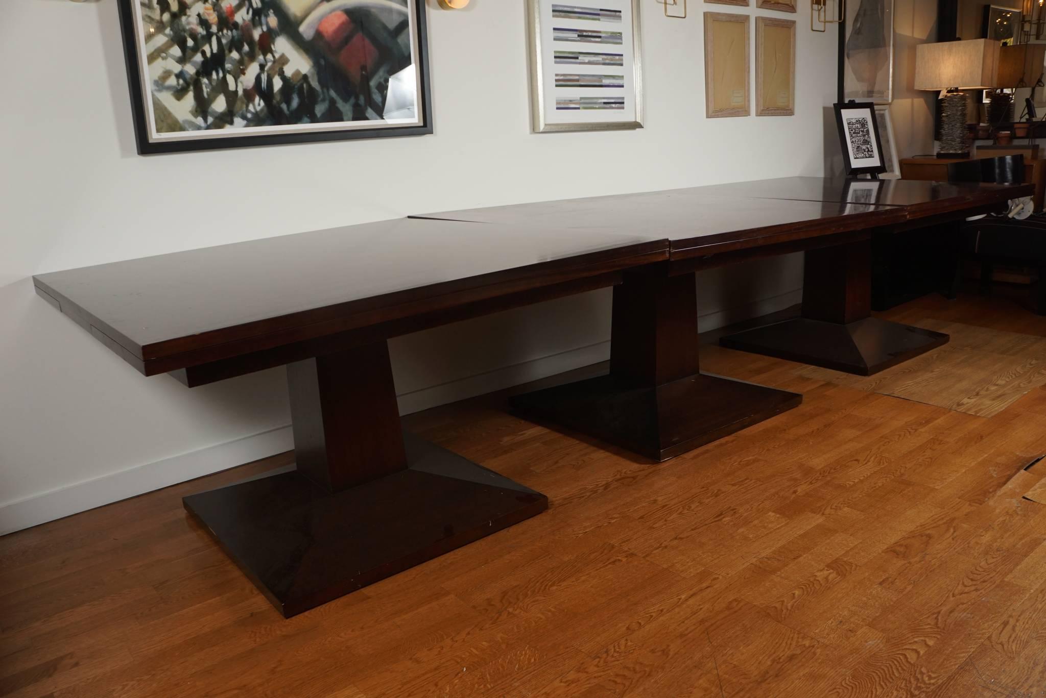 Large, three-part mahogany veneer, dining table.
The table consists of three, individual pedestal tables, each 52