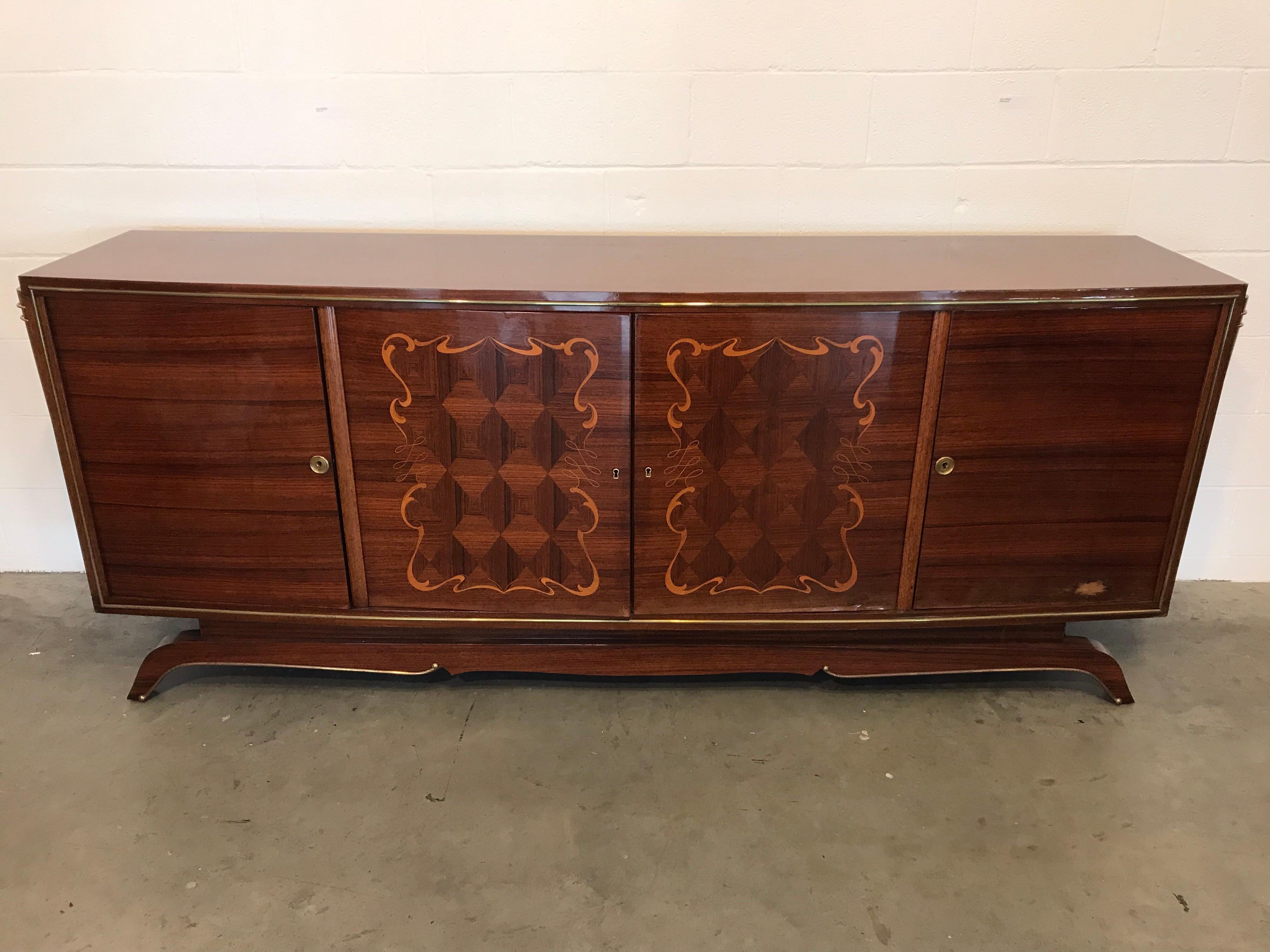 Buffet with bronze detailing and intricate wood marquetry.