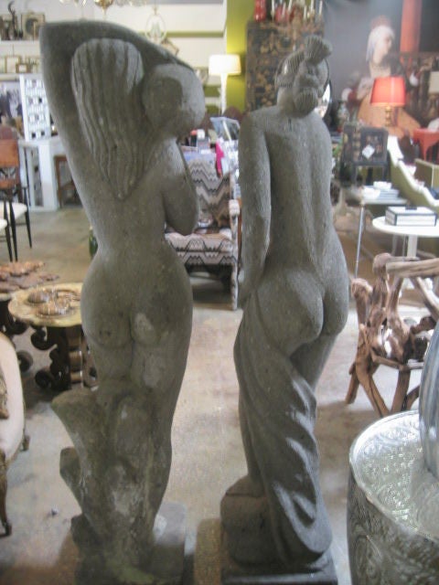 Carved stone sculptures of woman bather in the tradition of classical poses from antiquity.
