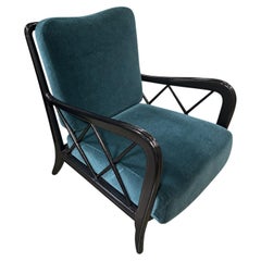 Poltrona italiana in legno laccato nero e velluto verde, anni '40 circa.