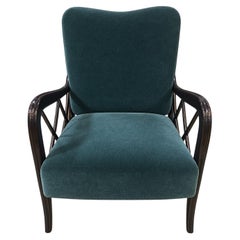 Poltrona italiana in legno laccato nero e velluto verde, anni '40 circa.