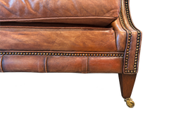 Vintage English Style Cognac Leather Two-Seat Sofa with Rolled Arms and Casters