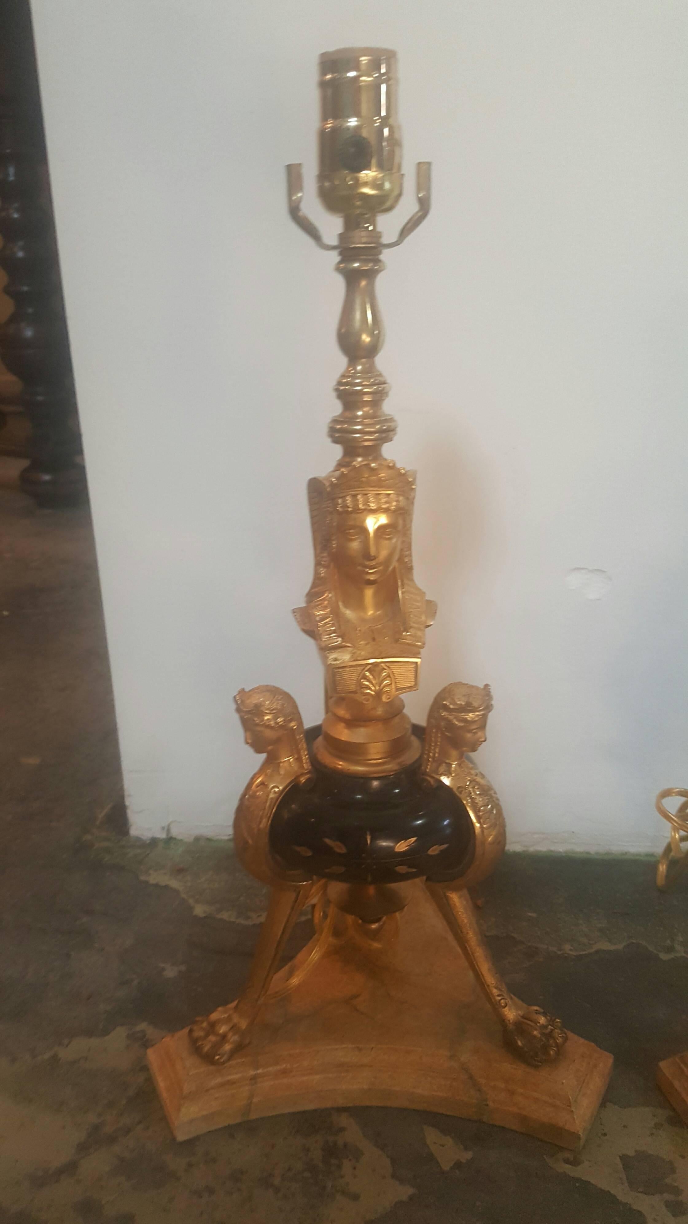Pair of 19th century French Egyptian revival lamps in doré bronze and marble with a faux marble base. Newly wired, ready-to-go.