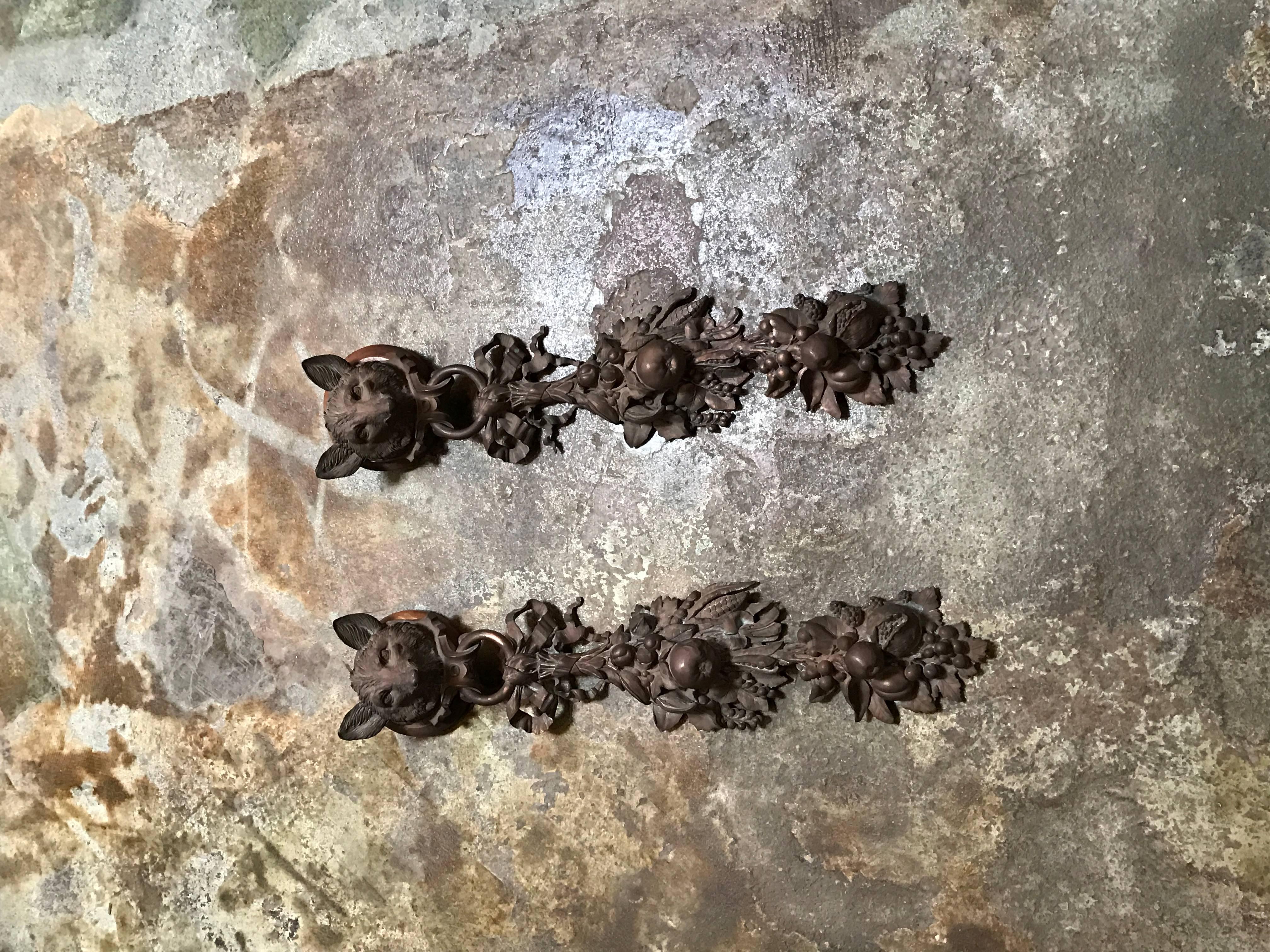 A pair of French bronze doré wall mounts crafted in the 19th century. 

Exceptionally carved foxes holding carved fruit and leaves.