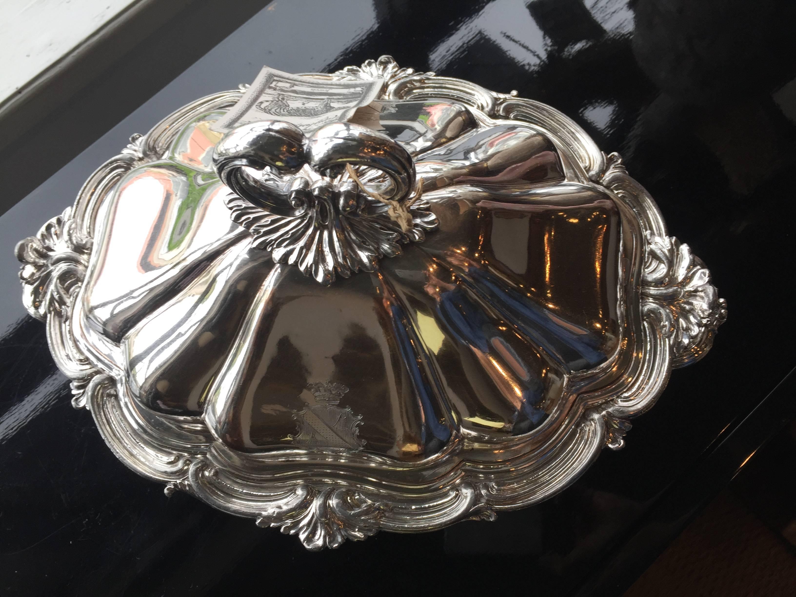 Silver Tureen in four compartments
Created in mid-1950s
Engraved coat of arms on either side of top.
 
