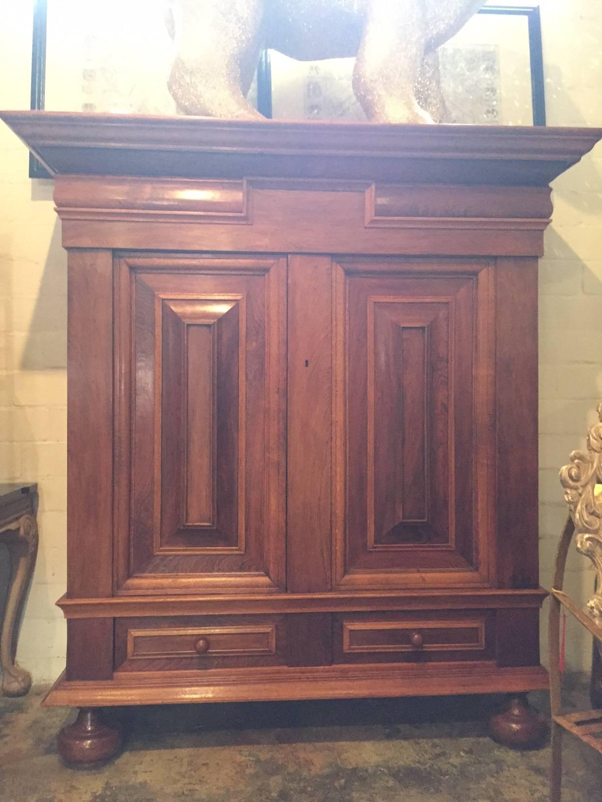 Dutch KAS wardrobe cabinet from the 19th century. Solid oak mitered on door panels rosewood raised panels on door panels and solid oak
Bun feet and single drawer at base
Cornice is carved and creates the perfect scale for the piece.