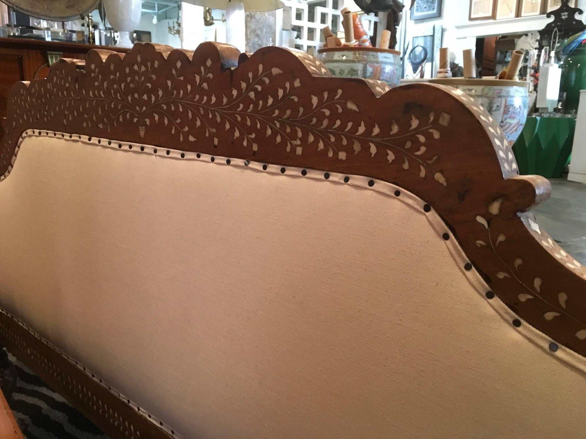 Hand carved inlaid Anglo Indian sofa.
