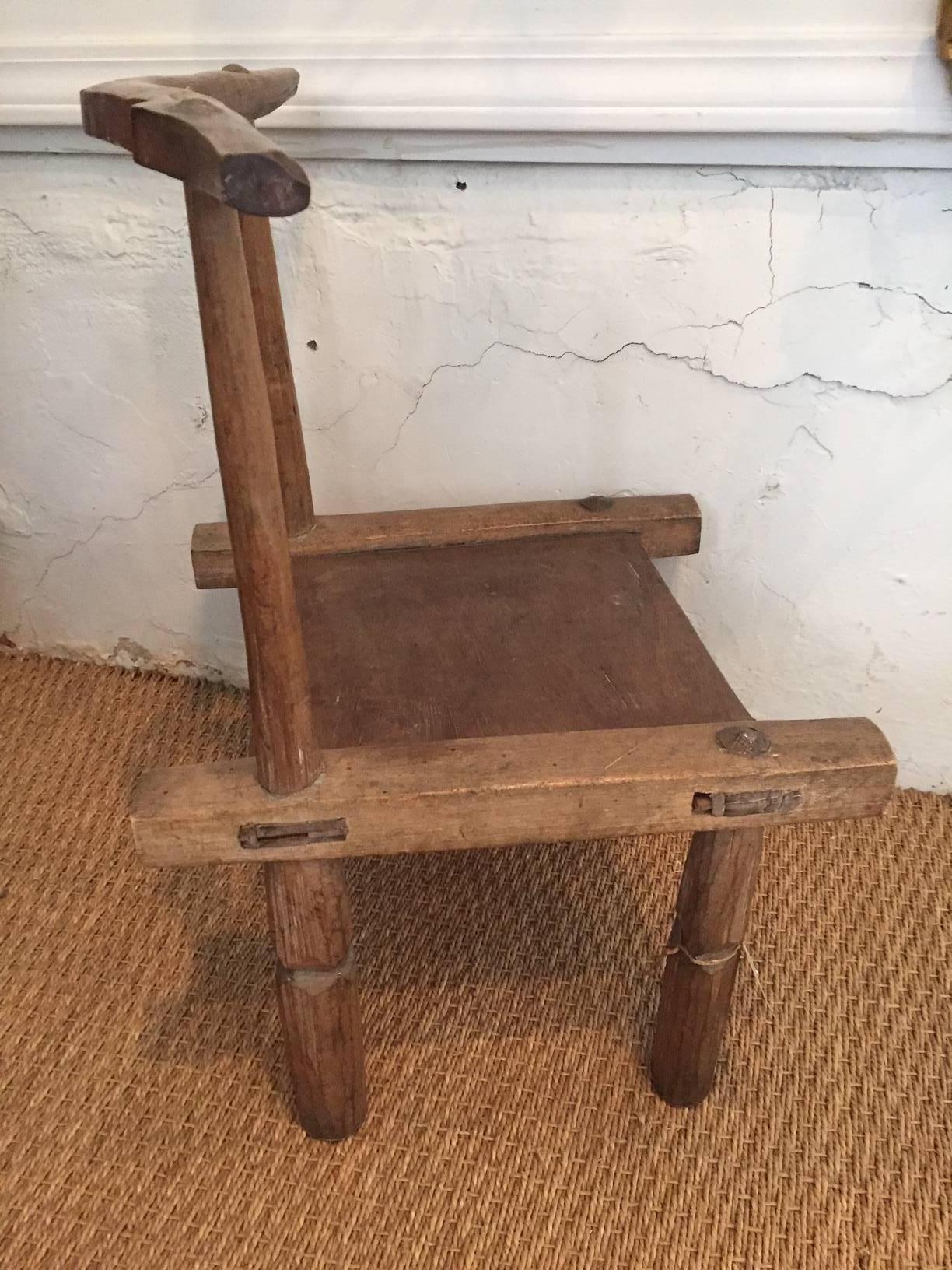 Hand-carved and handmade child's chair.