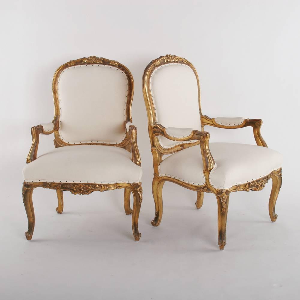 Carved and gilded pair of 19th century armchairs.

