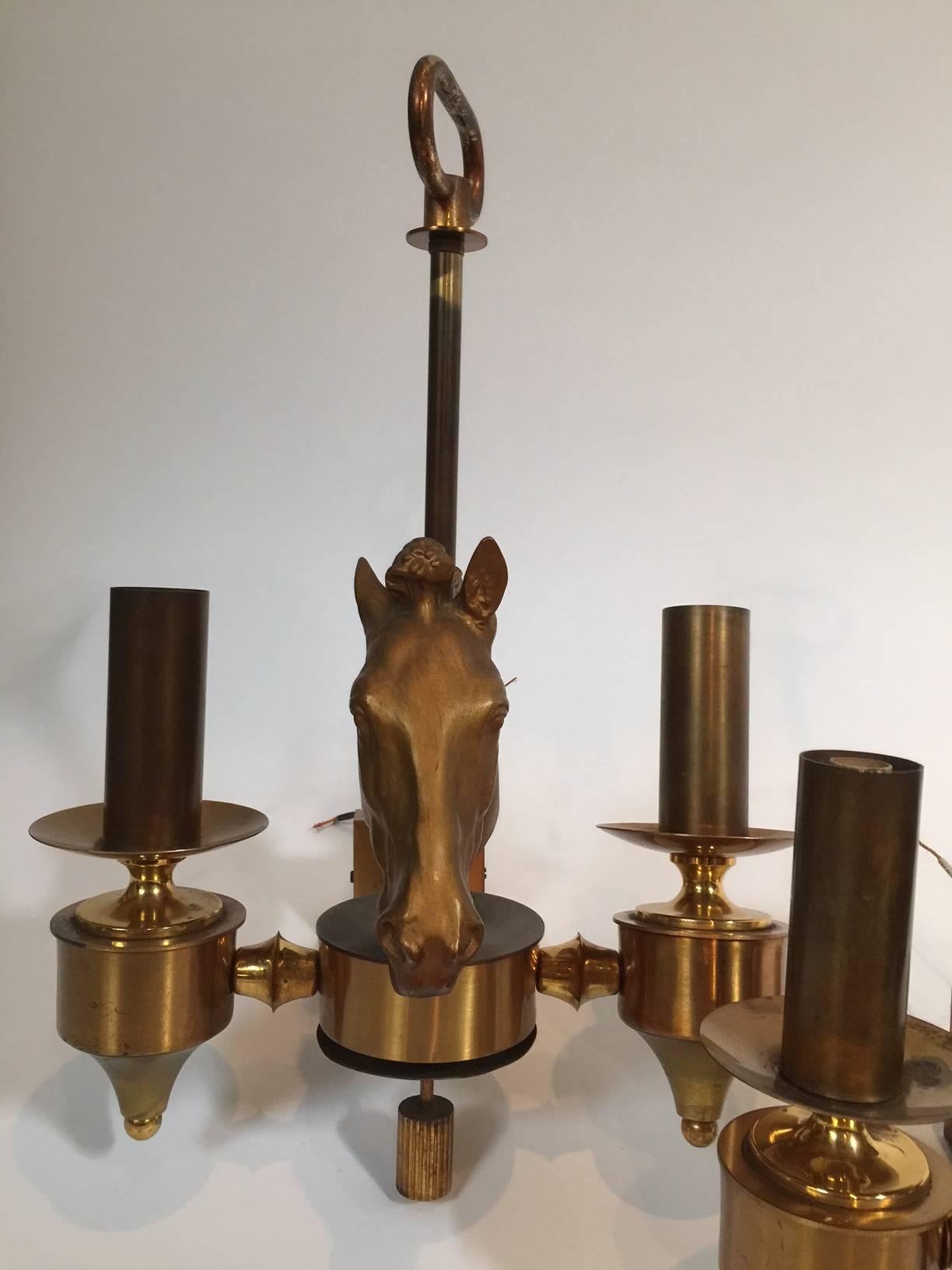 Vintage Maison Charles pair of Cheval sconces from 1940s
Electrified.
 
