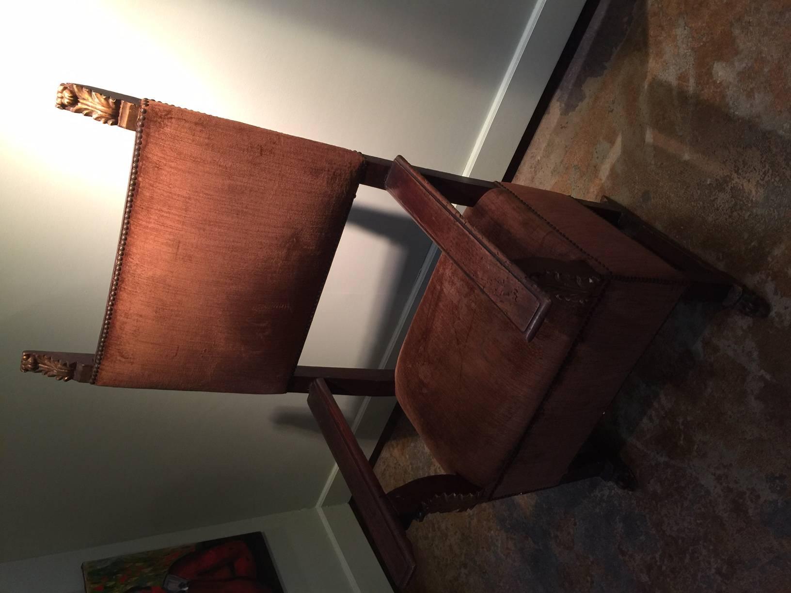 18th century Spanish colonial hall chair

Hand-carved with gold leaf decoration

Nail trim.