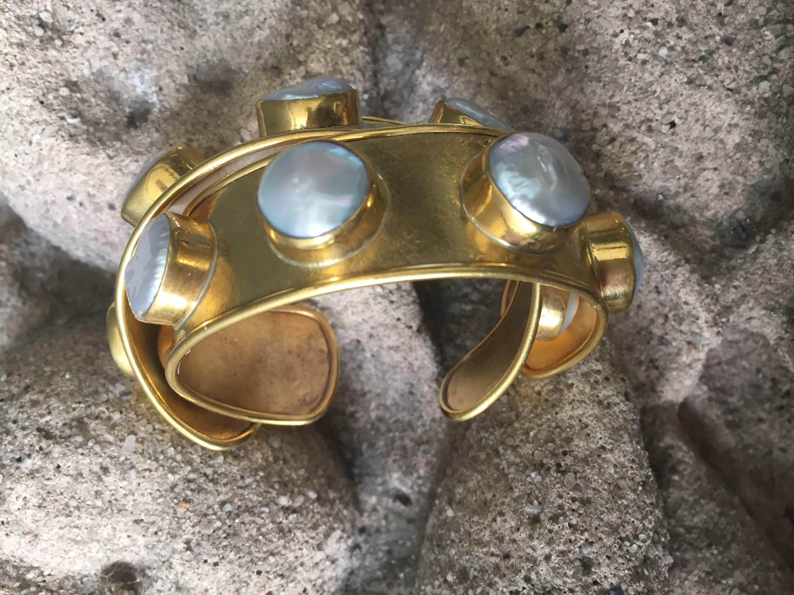 Michelle Nussbaumer rock candy cuffs with fresh water pearls available as 
a pair

Bronze dipped in 22-karat gold.