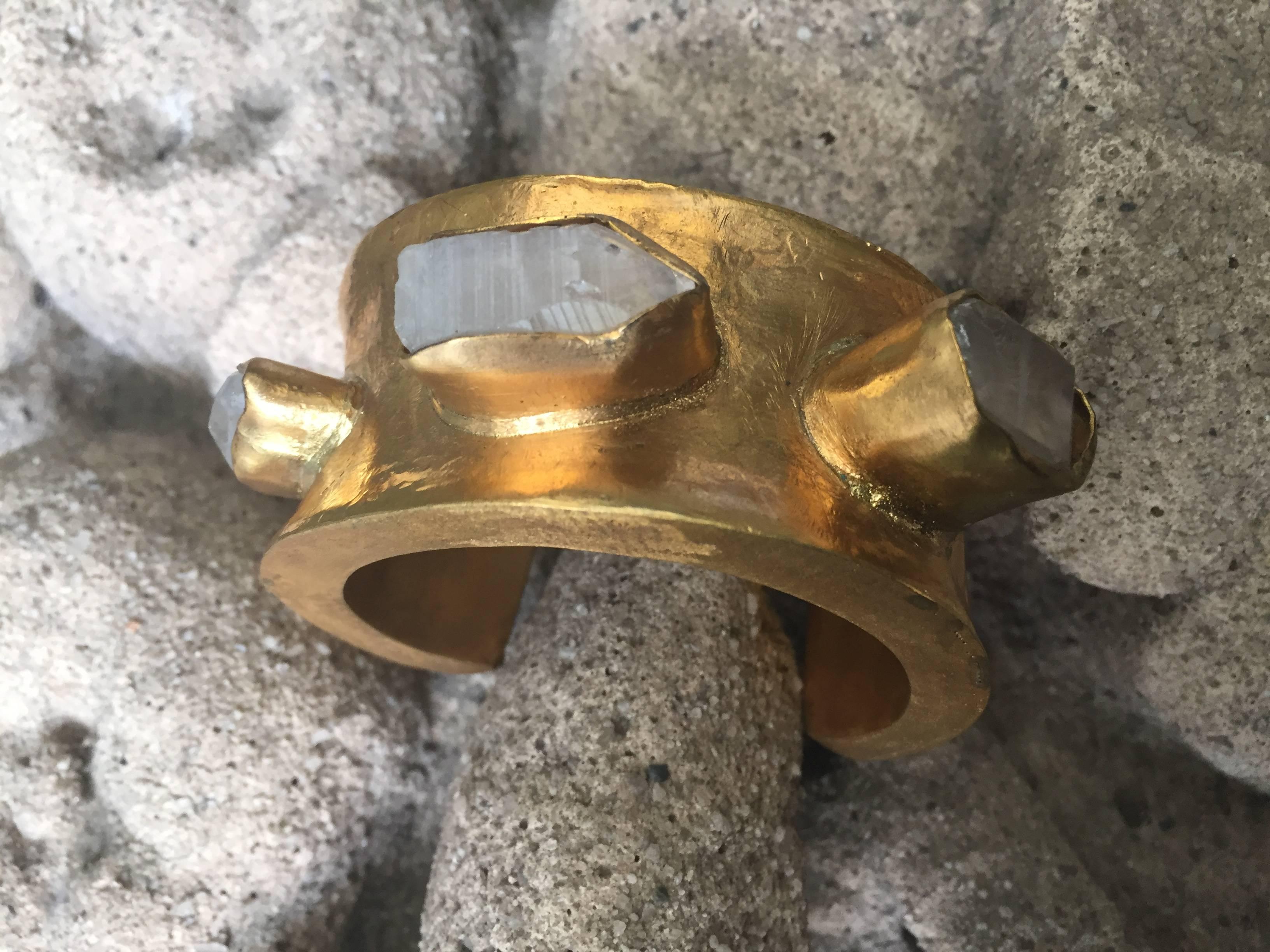 Rock crystal rock candy large cuff bracelet by Michelle Nussbaumer

Bronze dipped in 22-karat gold with rock crystals.