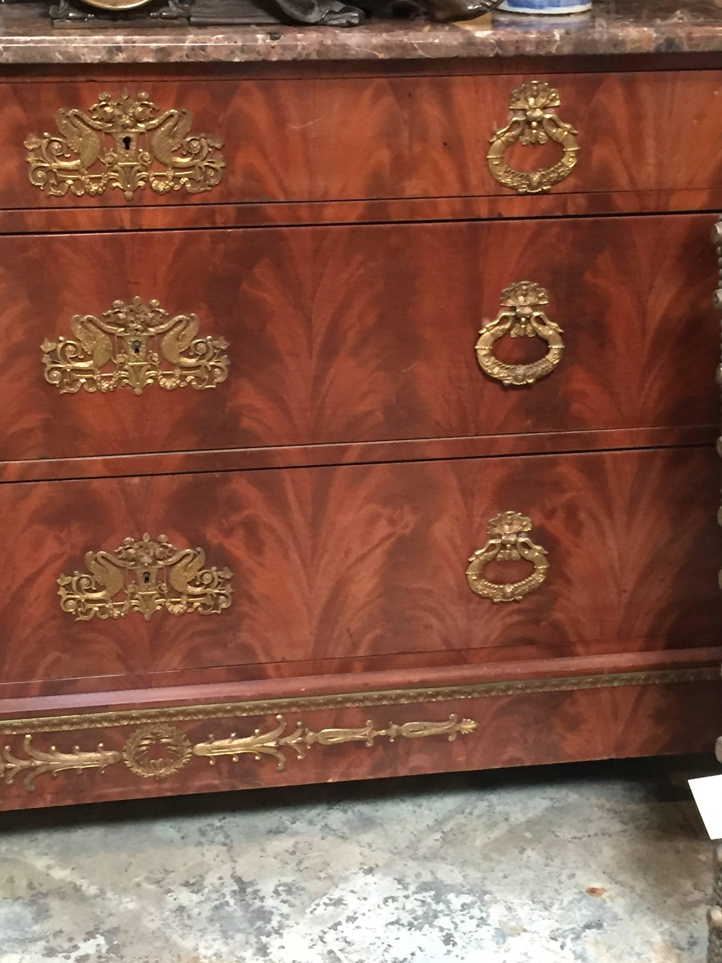Three-drawer 19th century Empire Chest
Ormolu mounts
original hardware and marble top.
 