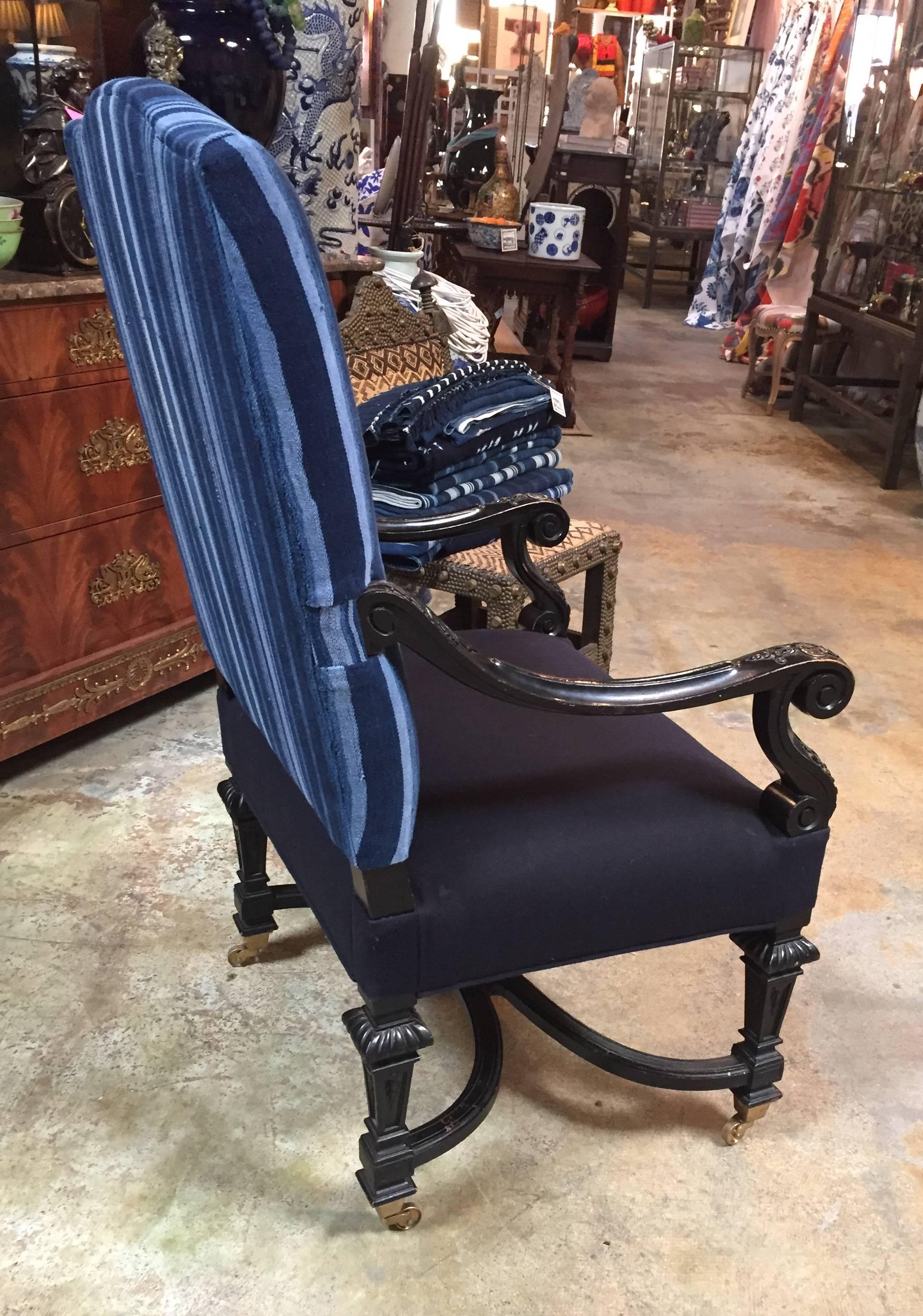 Pull up chair finished in black and upholstered inside and outside back in antique Indigo textile from, Africa.
Seat is covered in coordinating solid fabric.