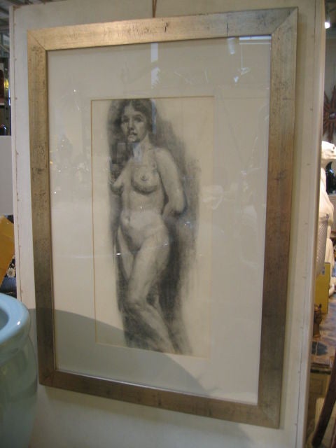 A beautiful charcoal drawing, one of a pair. Model is facing to her right. Custom matted and framed in a contemporary silver-leaf frame with glass.