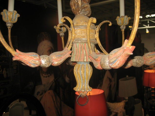 Whimsical six-light chandelier featuring a monkey wearing a 19th century bicorn hat and uniform. Hand-carved wooden and metal details. Original gesso and painted finish.