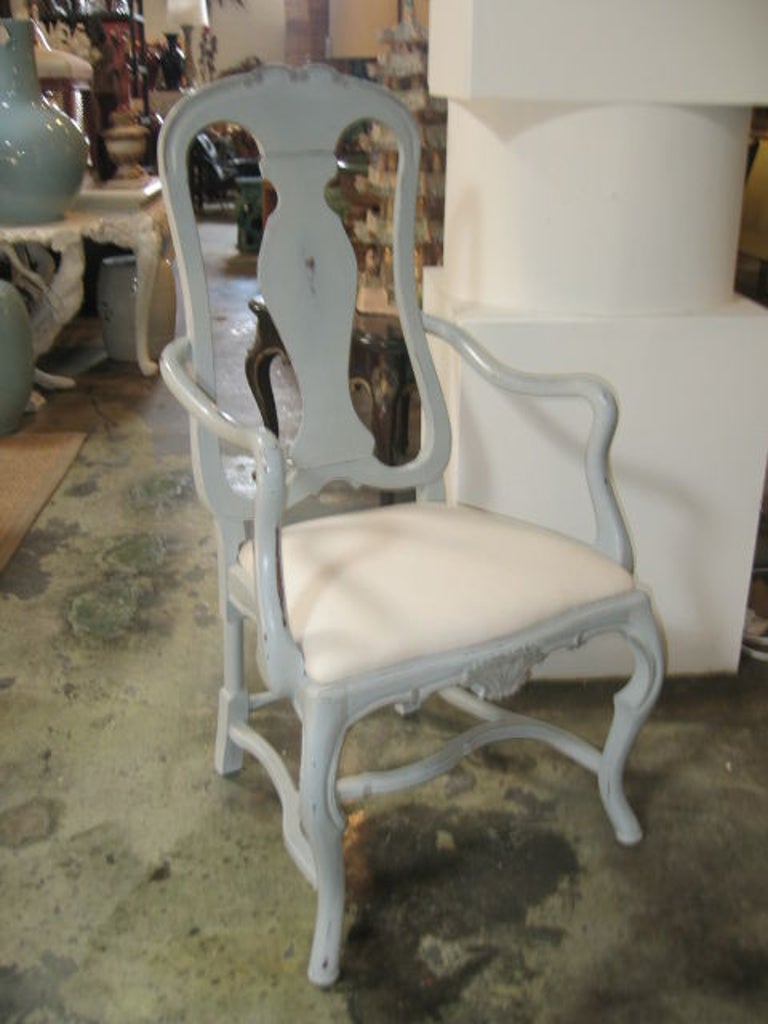 Hand-painted in Gustavian gray with a distressed finish. Hand-carved scrollwork and shell detail. Sold individually. 