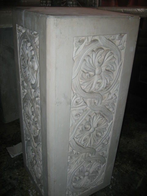 Vintage pair of plaster pedestals with ornate details of scrolls and acanthus leaves. Gothic in design.