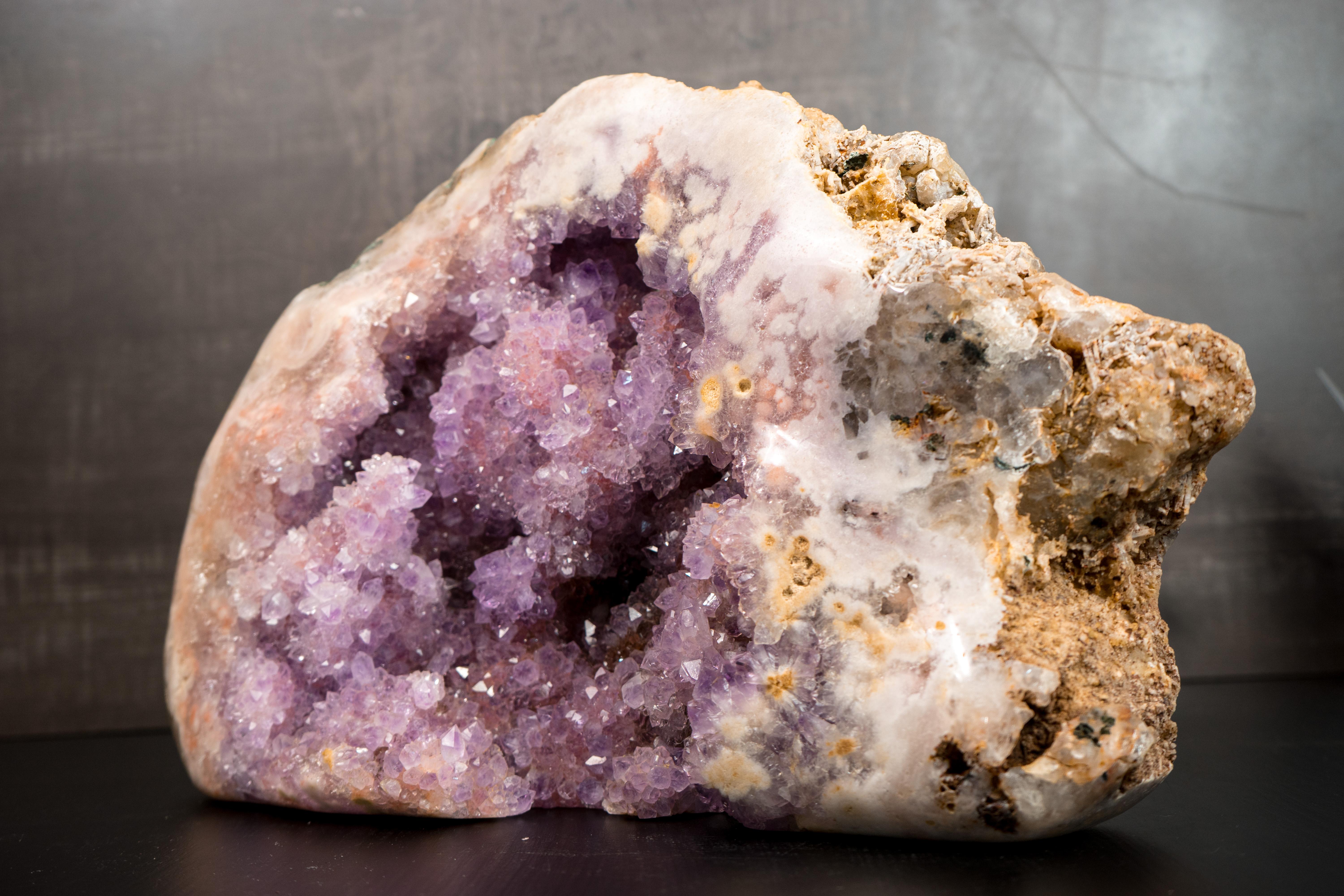 Rare, Large Pink and Purple Amethyst Geode

▫️ Description

Many pink amethyst geodes are found every year in Brazil, but this geode is a one-in-a-thousand find. It features a rare formation that blends purple, red, and pink colors, beautifully