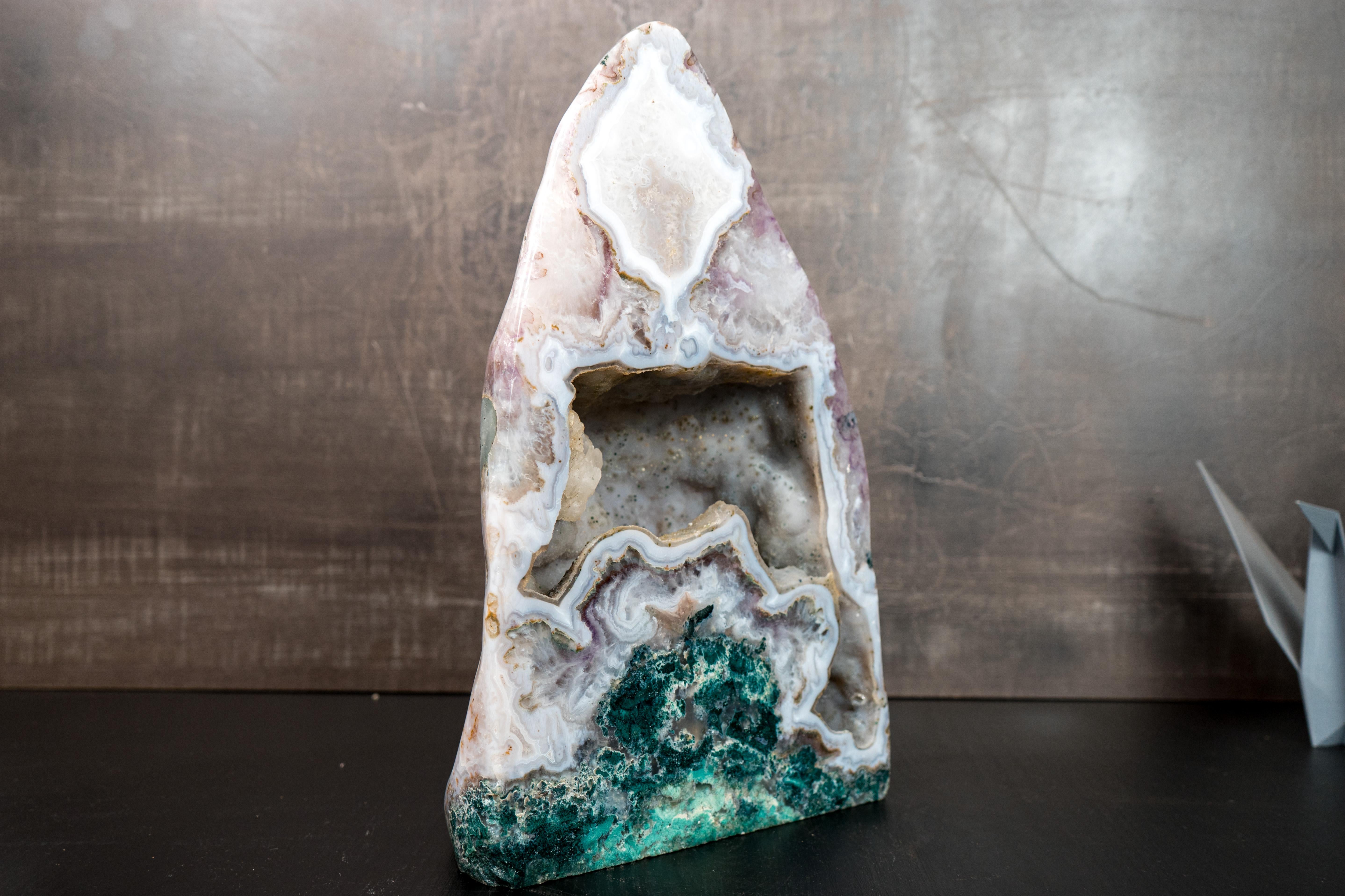Rare Agate, Amethyst and Jasper Geode

If you're searching for a truly rare geode, this is the one. It showcases a unique combination of features seldom found together—including a cave lined with tiny micro druzy crystals and vibrant green
